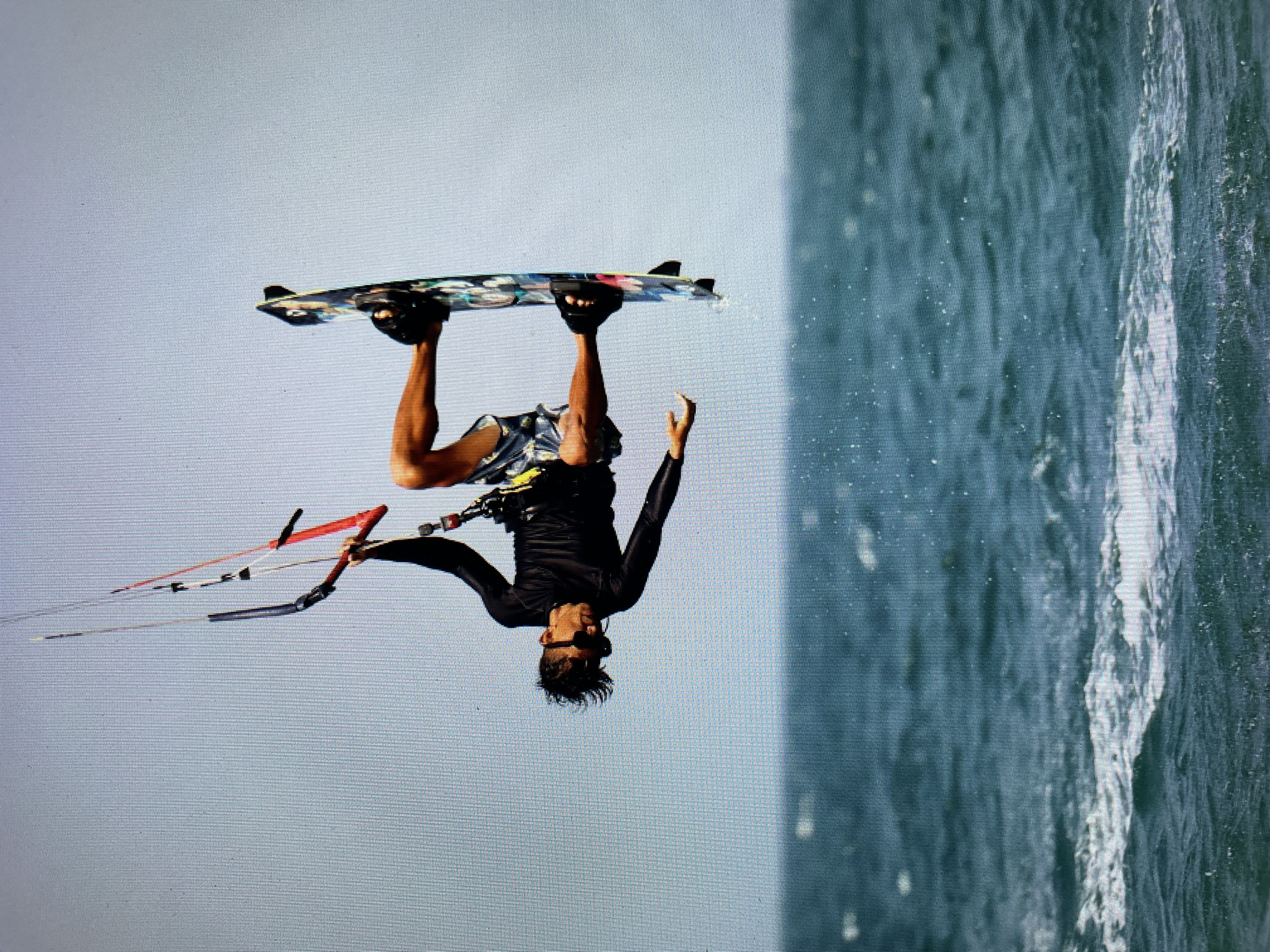 Kitesurfer performs aerial tricks off Bacong, Philippines coast