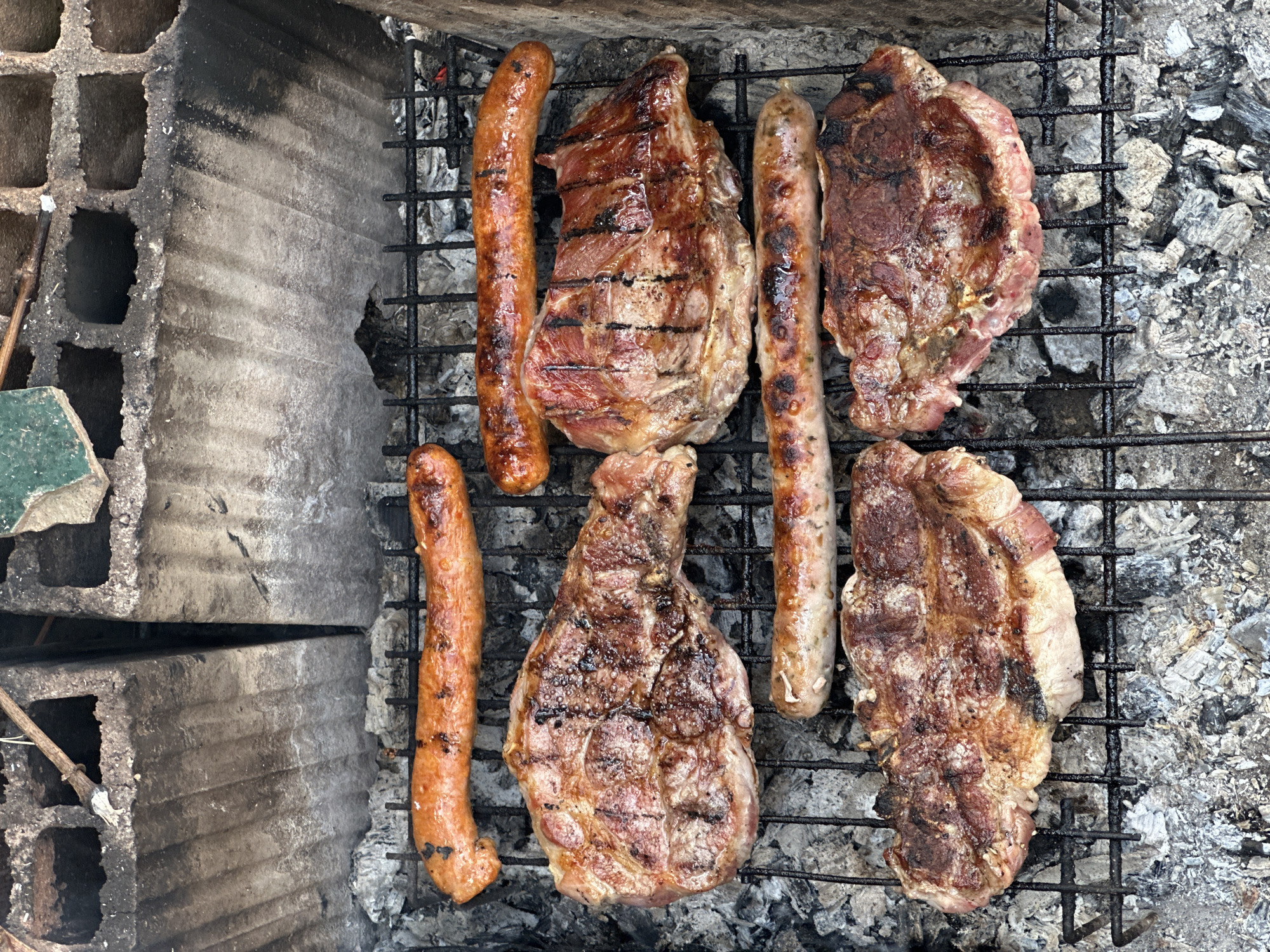 Outdoor barbecue cooking session documented in Mirkovo, Bulgaria