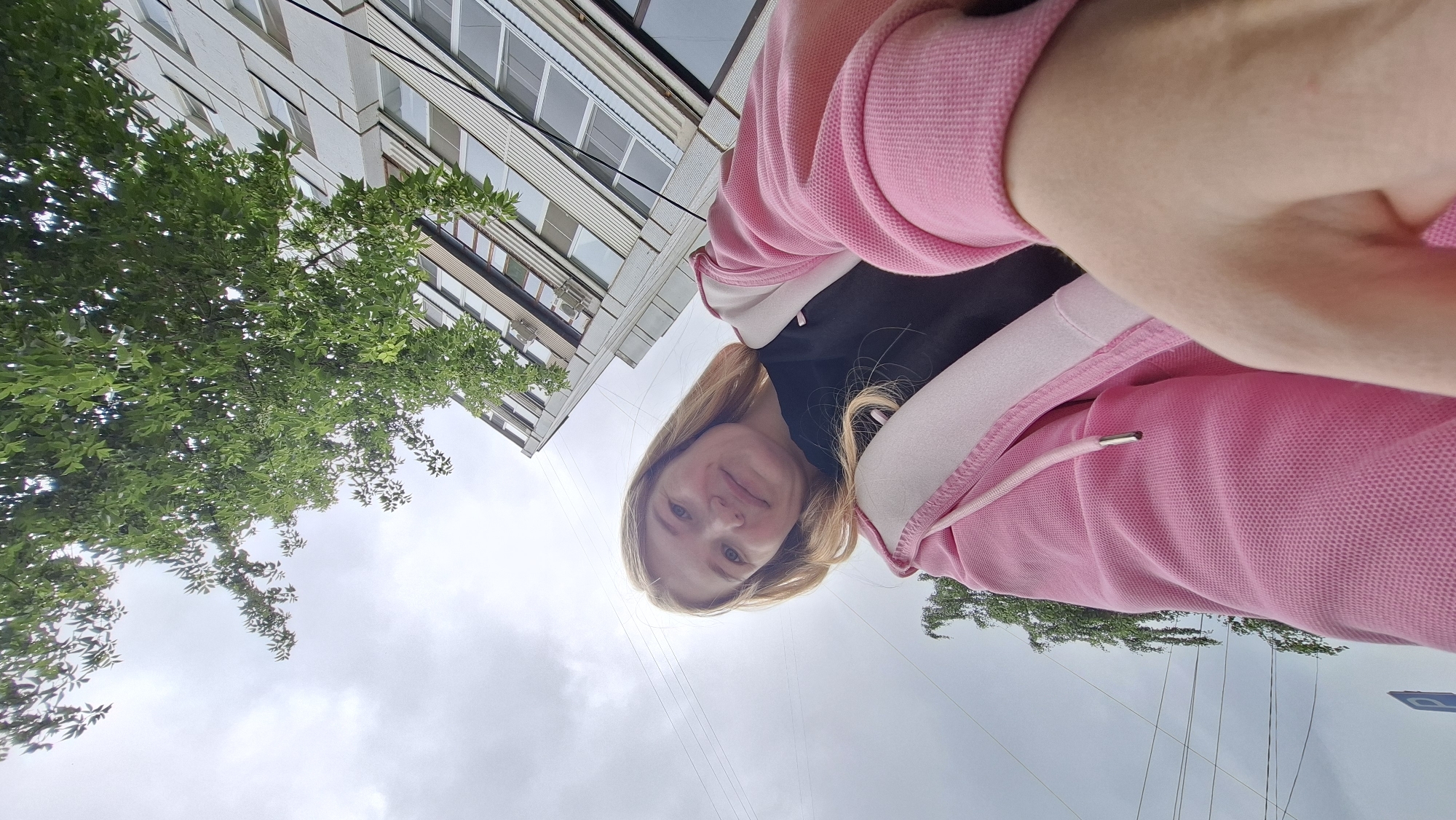 Selfie session outside a building in Chaikovsky on a grey morning