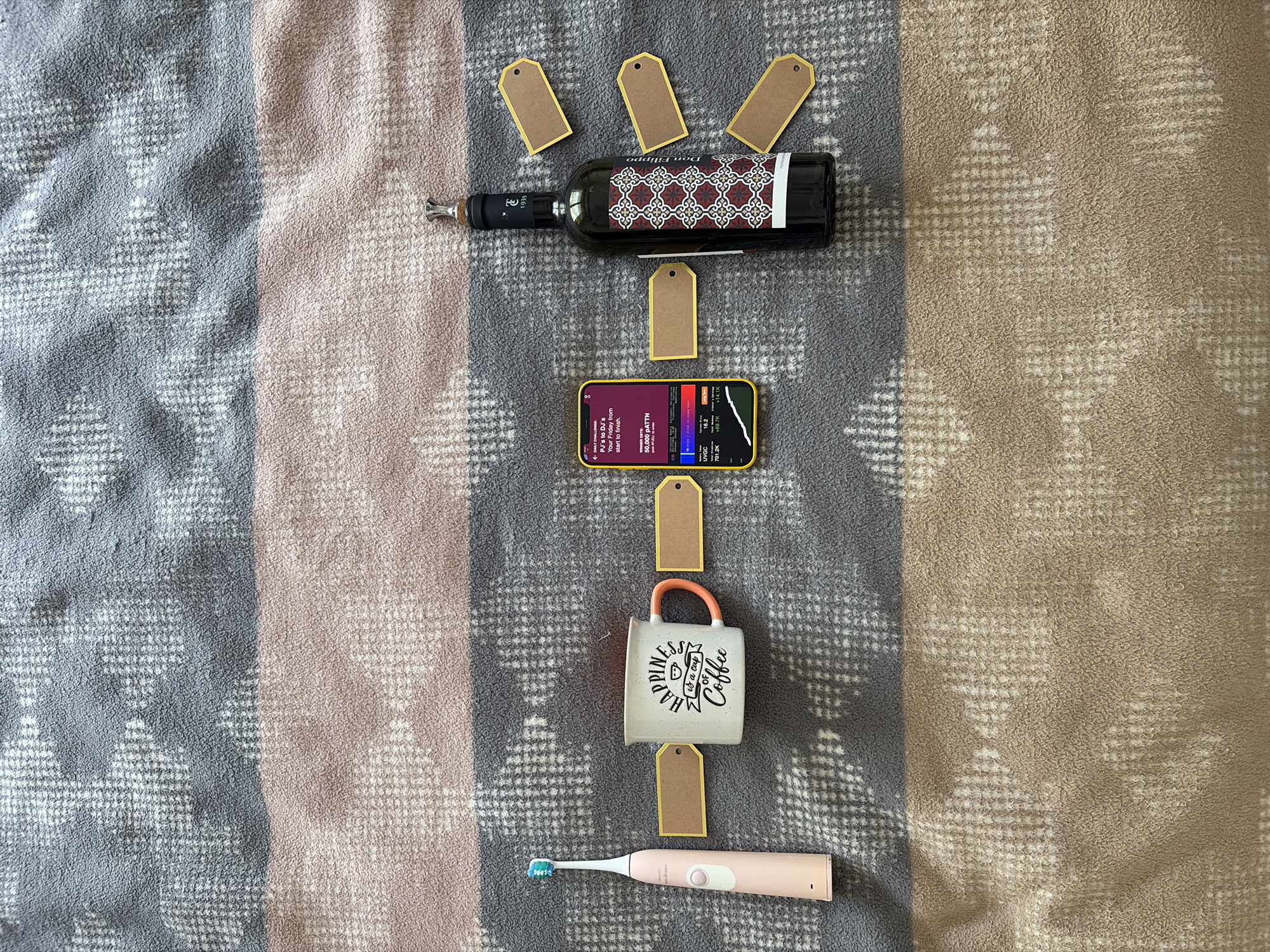 Personal items arranged on blanket in Budva, Montenegro