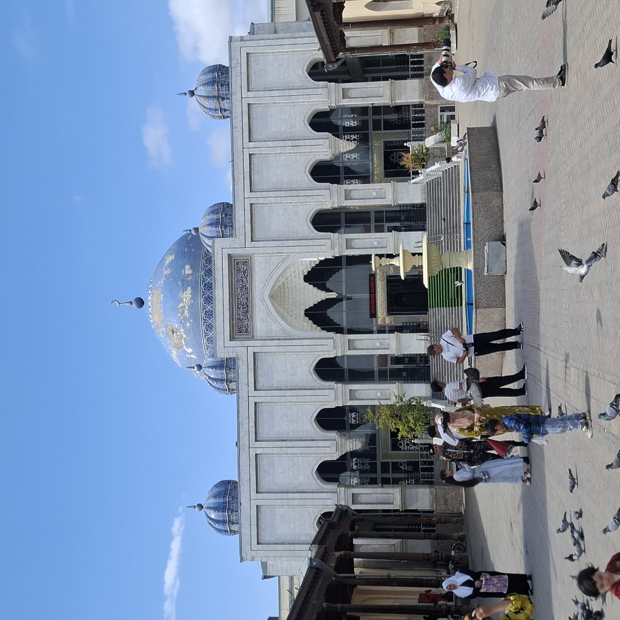 Morning marketplace activity captured around Khujand public square