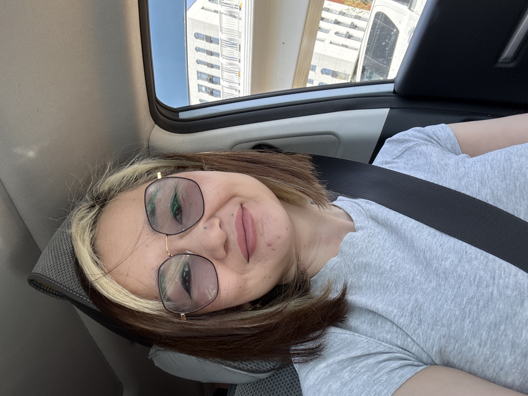 Woman observed sitting in car in urban Astana