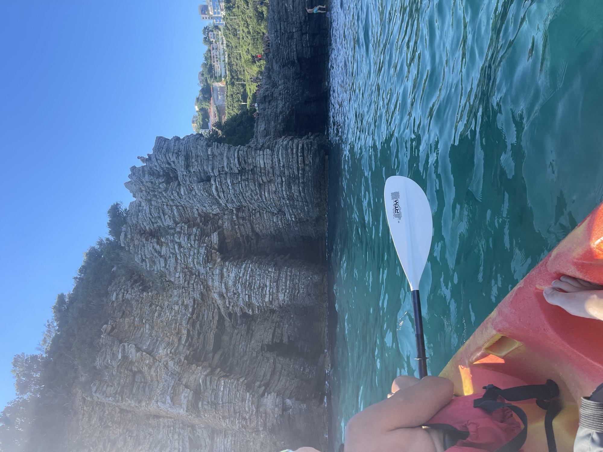 Cliff jumping and kayaking off Budva's rocky coastline