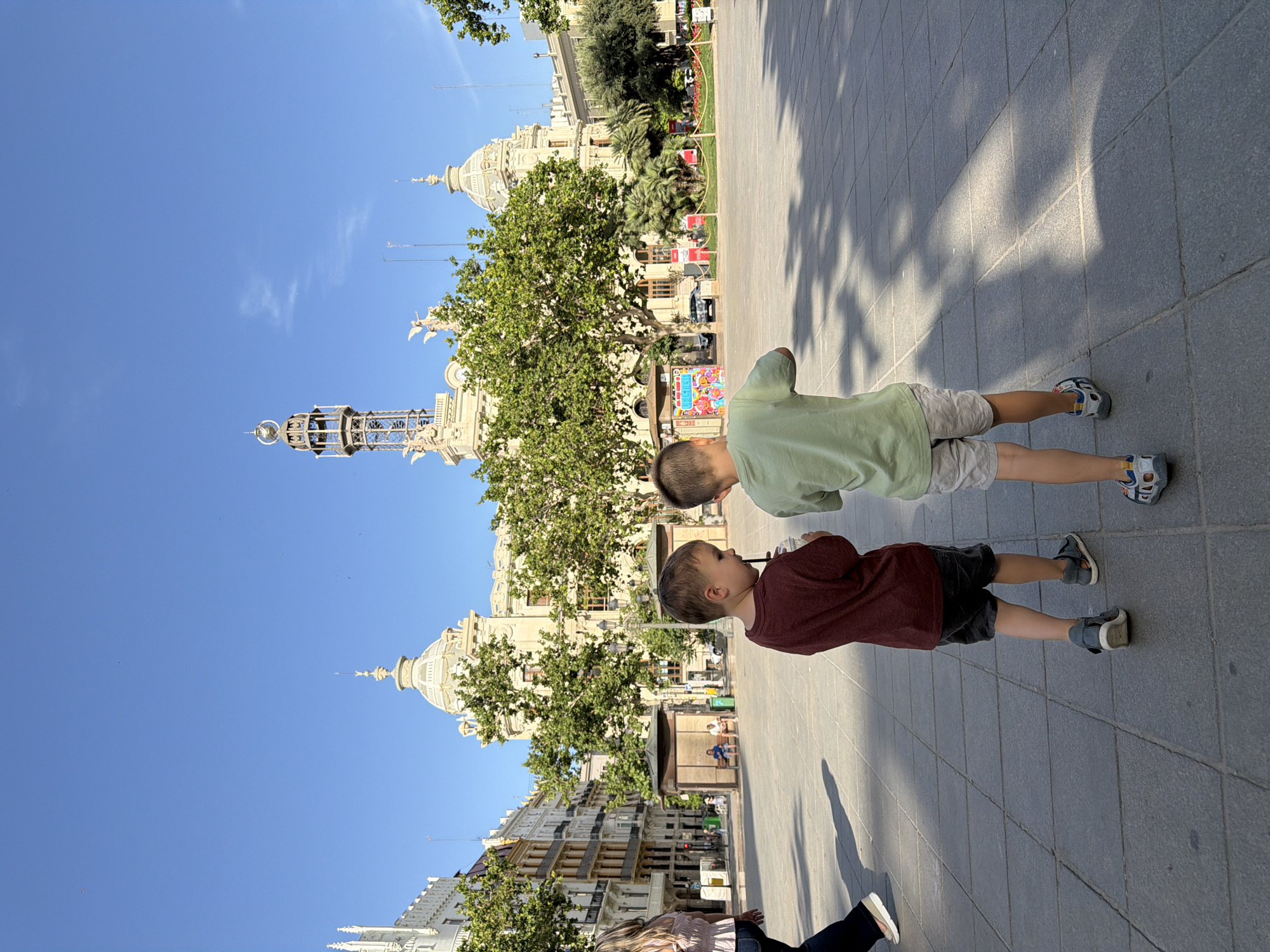 Plaza exploration in Valencia with historic architecture and fountains
