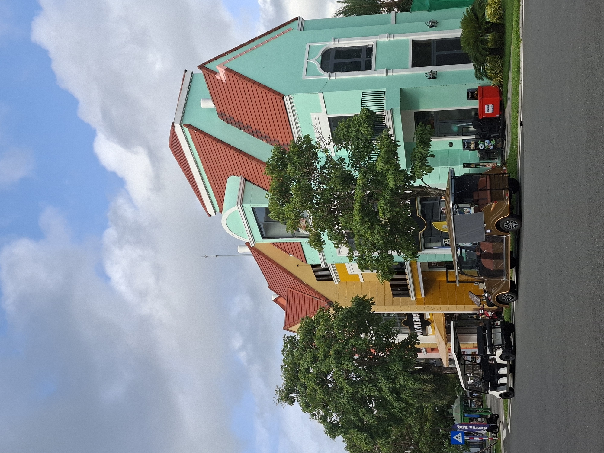 Colorful waterfront resort town with clock tower and European architecture