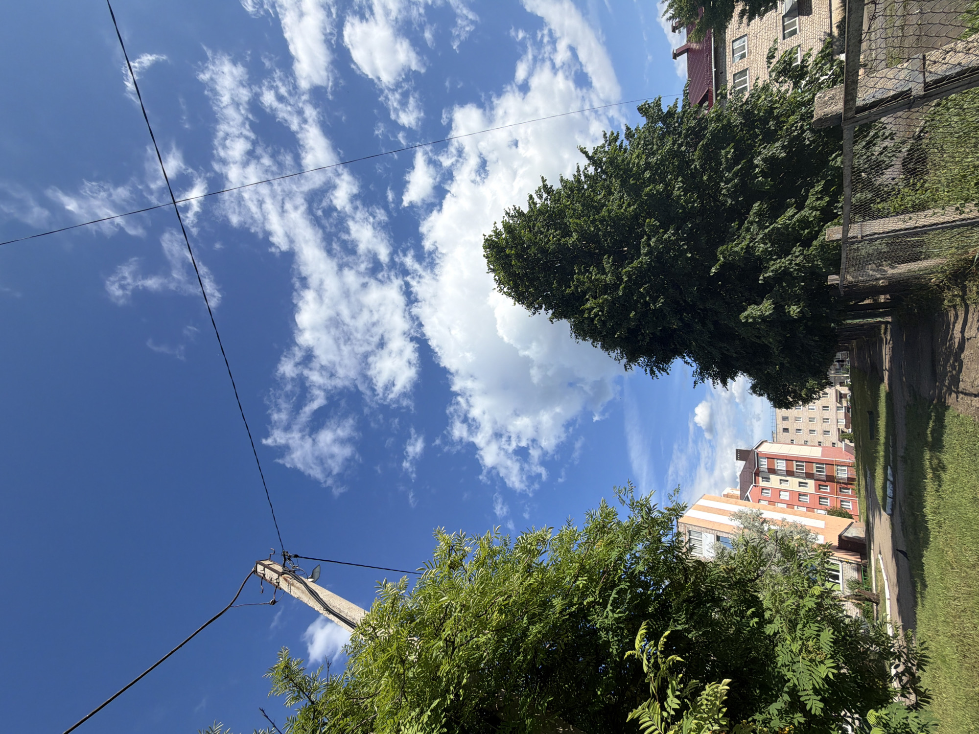Woman documents sunny afternoon stroll through Tujmazy, Russia