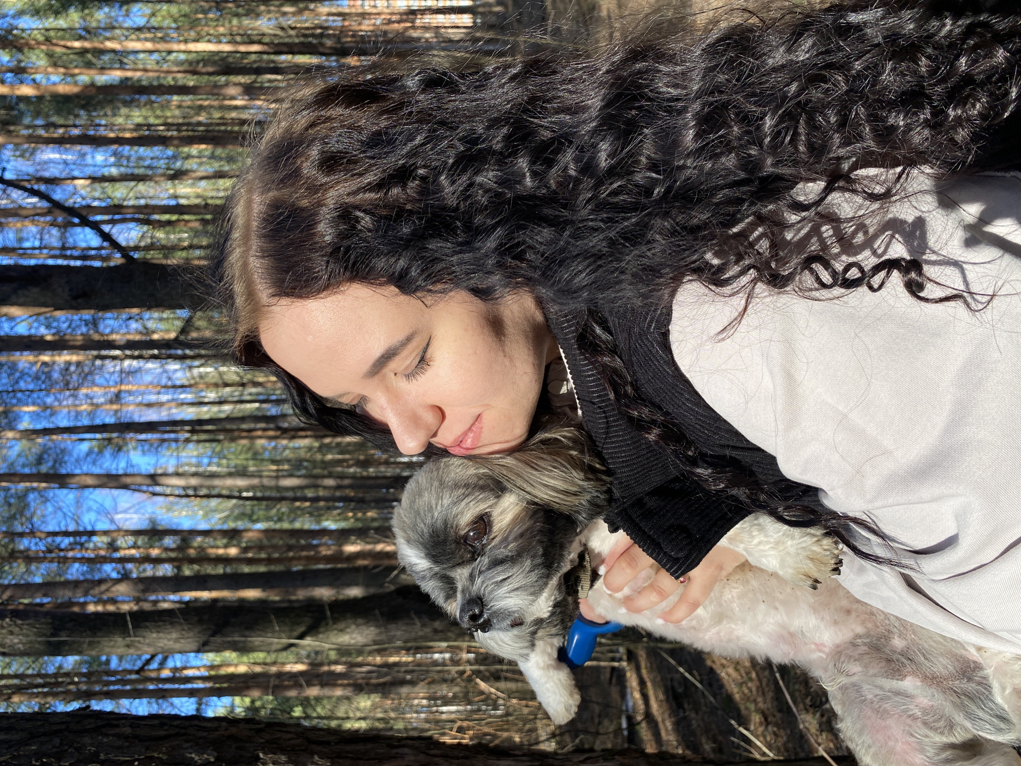 Women enjoy woodland outing with dog in Chaikovsky