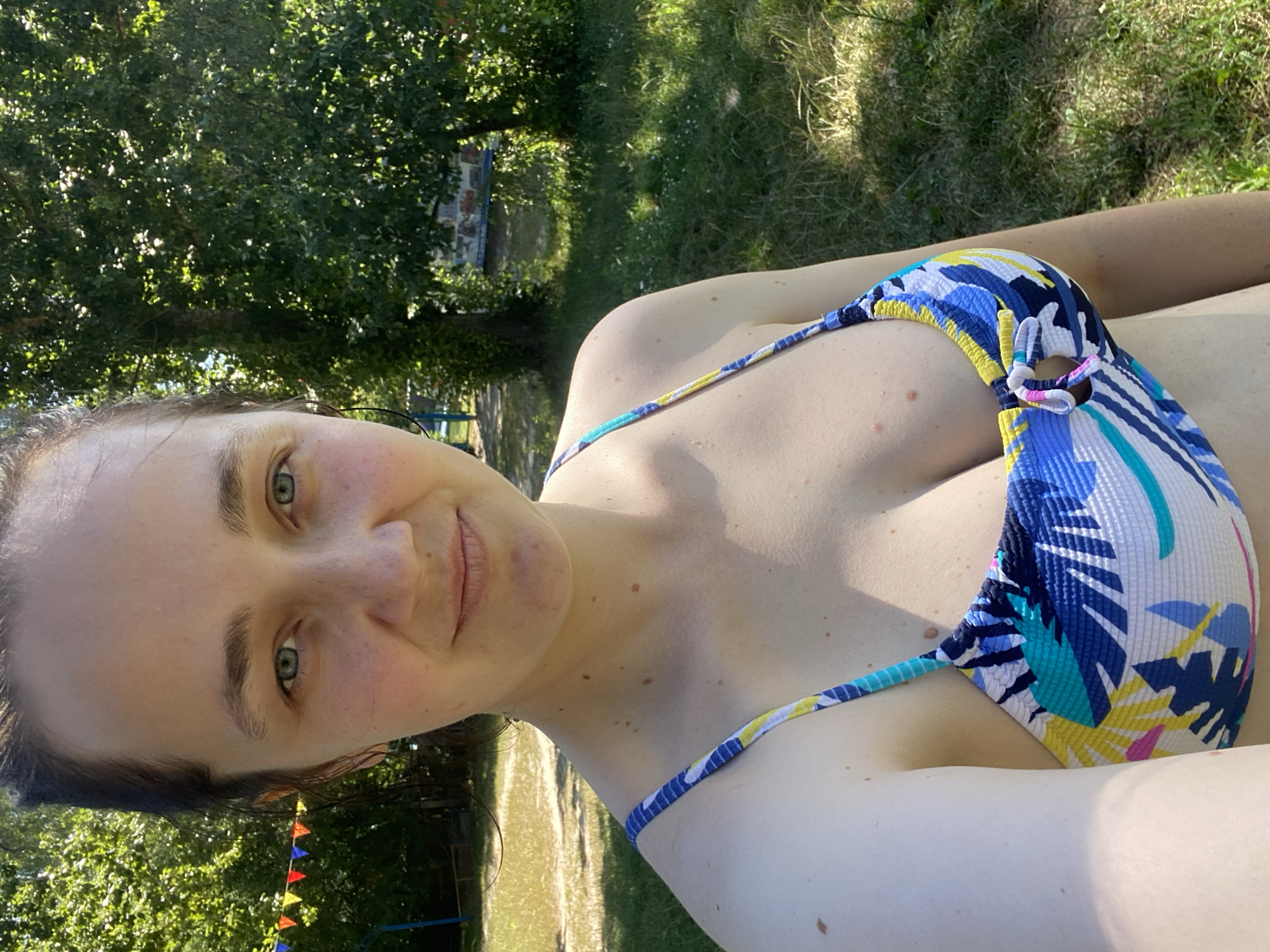 Sunny beach morning with selfies and grassy shoreline views
