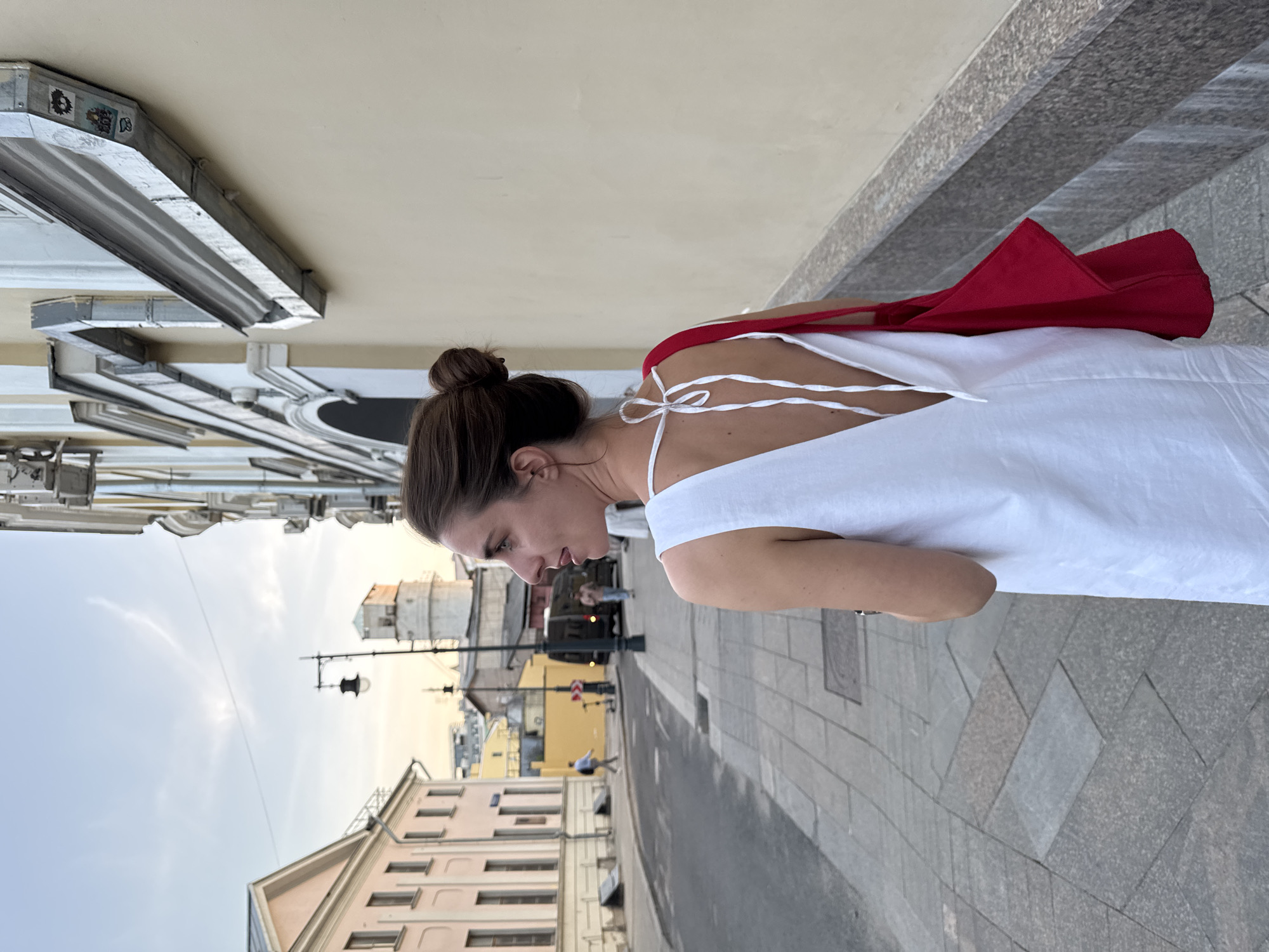Woman in white dress observed walking through central Moscow