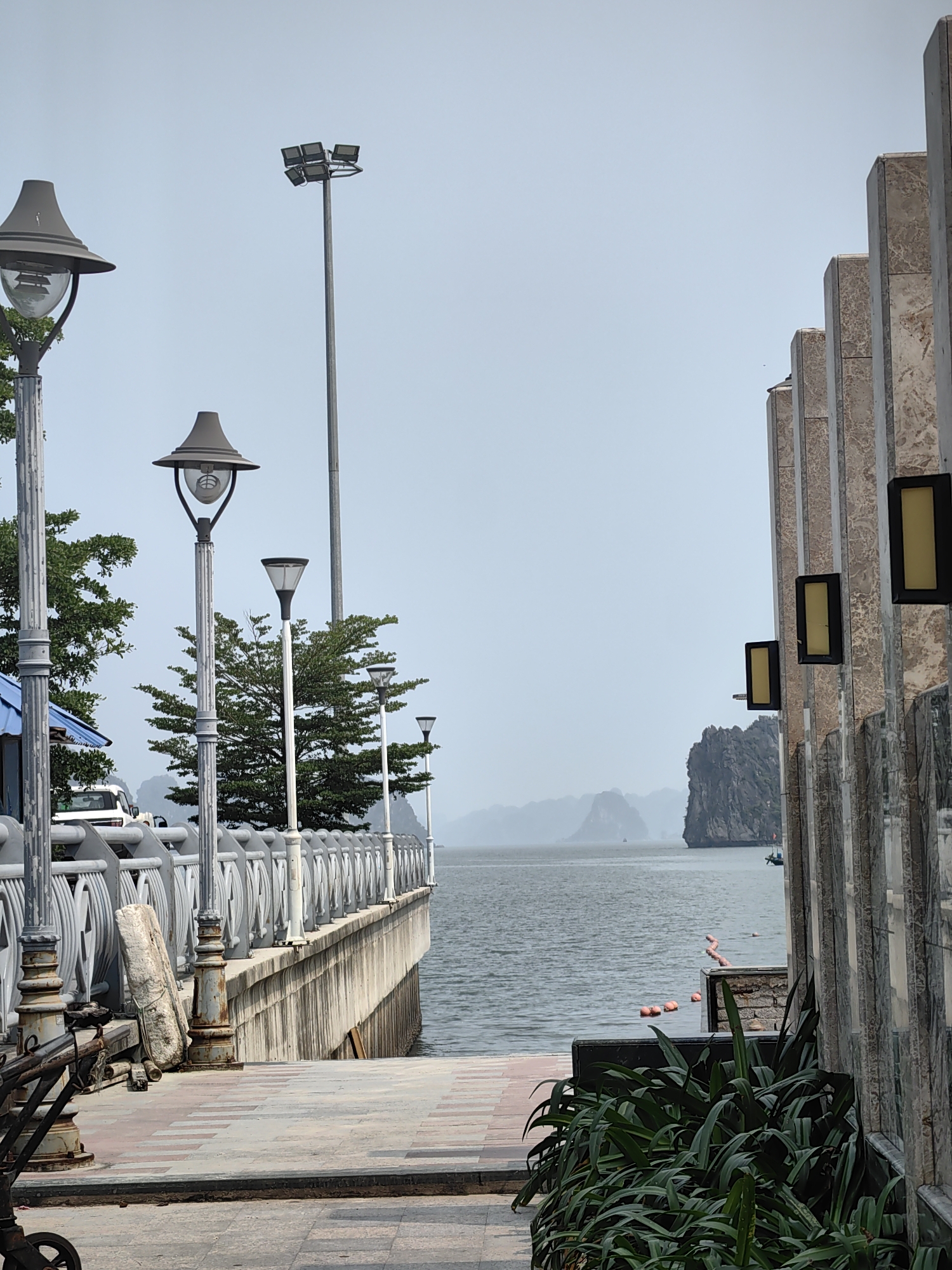 Couple documents early morning beach visit in Ha Long Bay