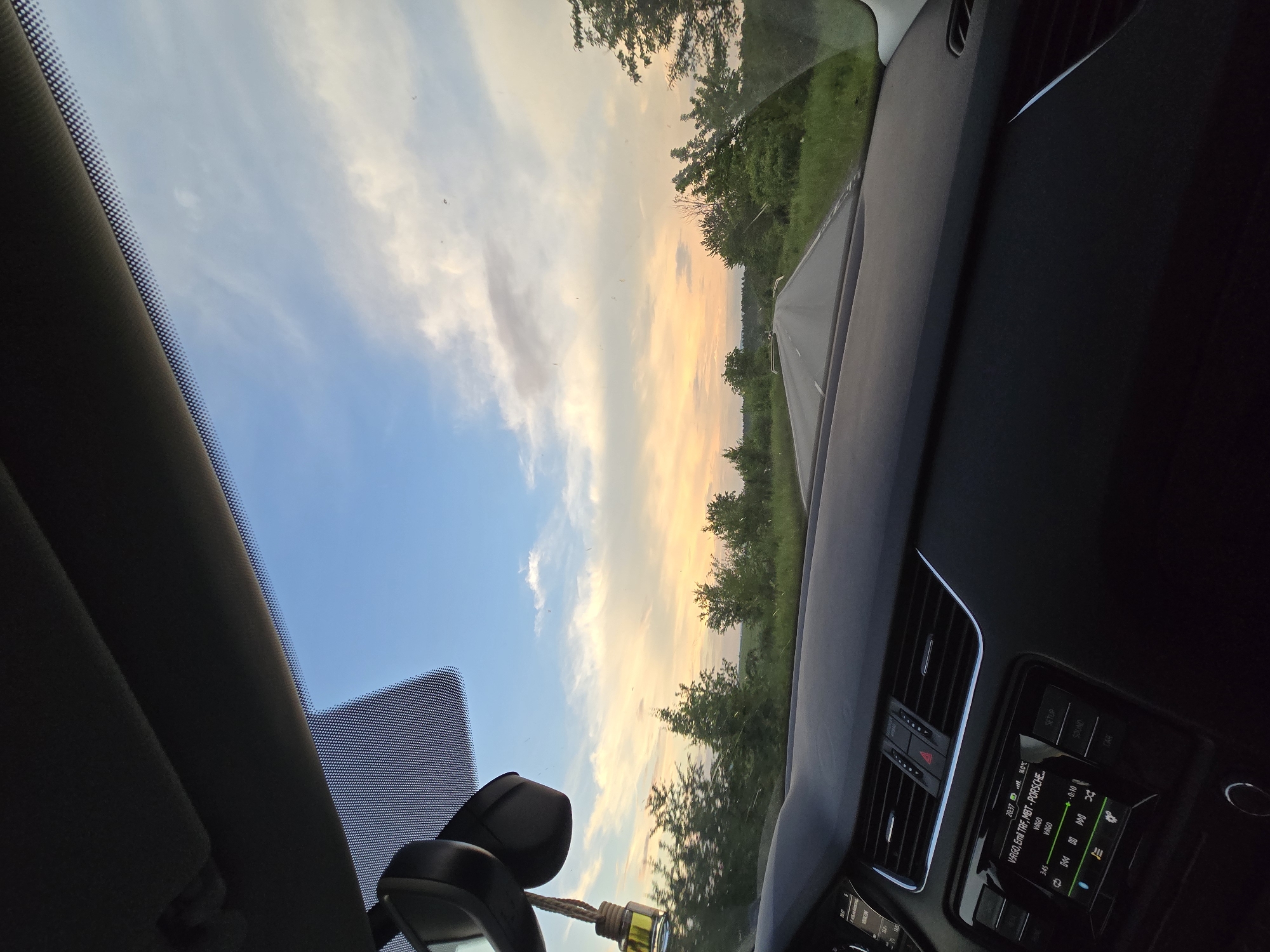 Motorist documents afternoon drive under overcast skies