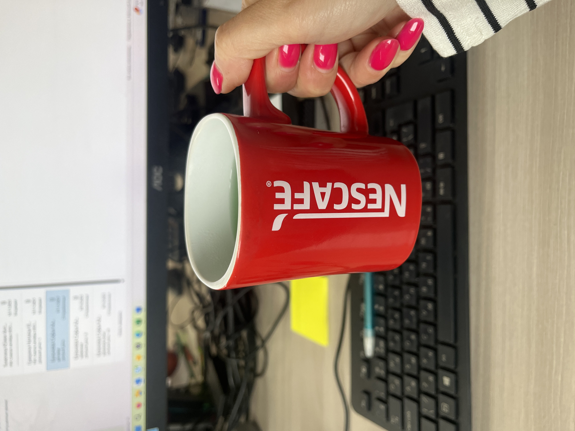 Morning desk corner in Chelyabinsk with coffee and houseplants