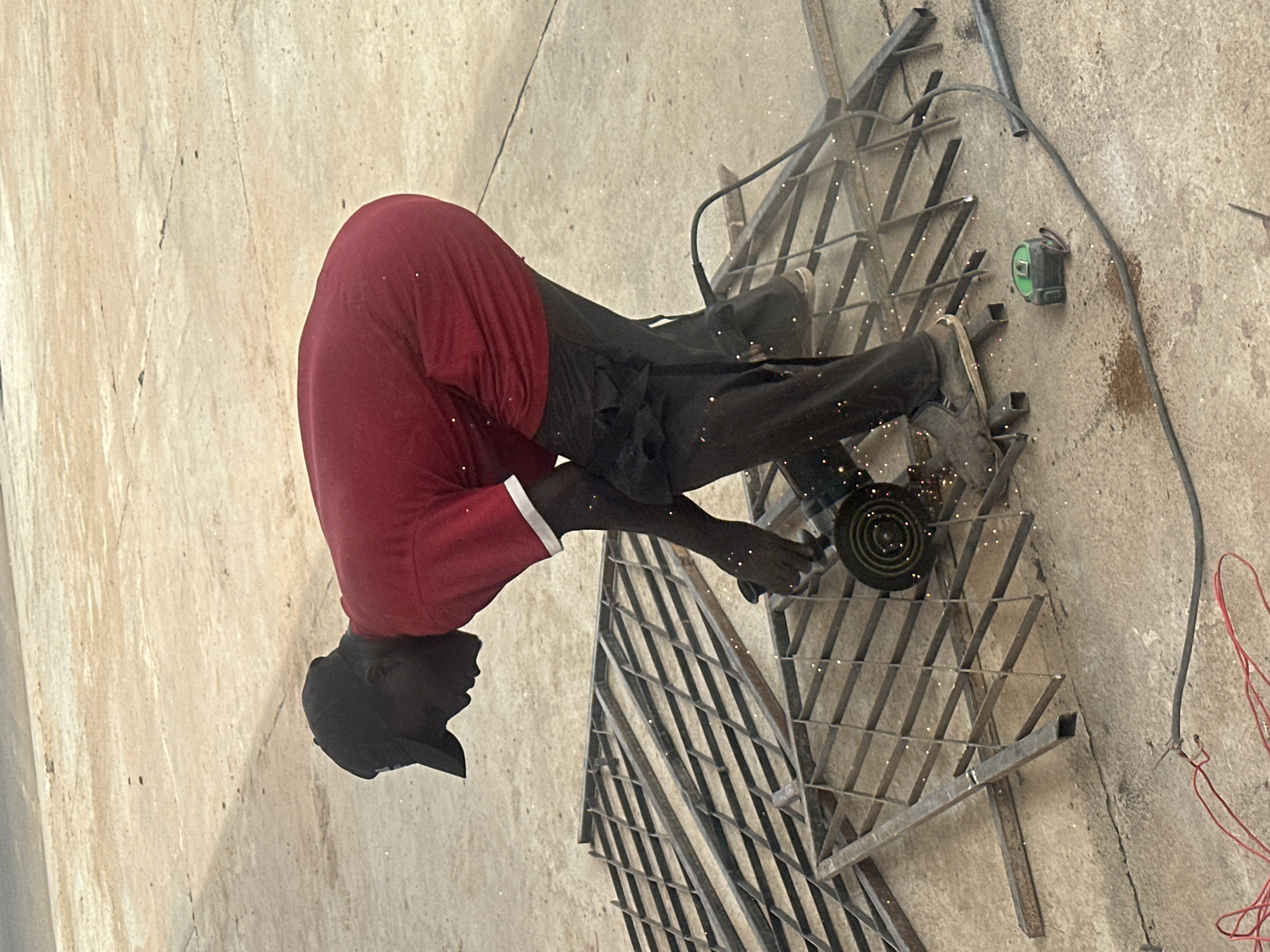 Angle grinder work on metal grating, Barakin Lerawi, Nigeria