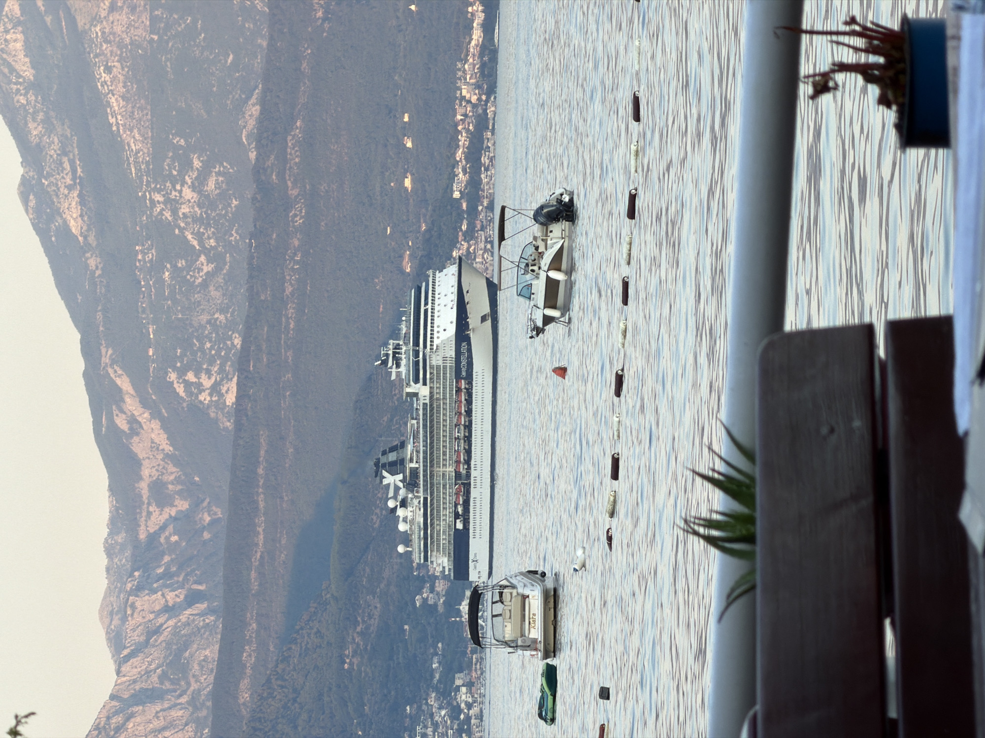 Waterfront dining with Celebrity Constellation in the bay, Đenovići