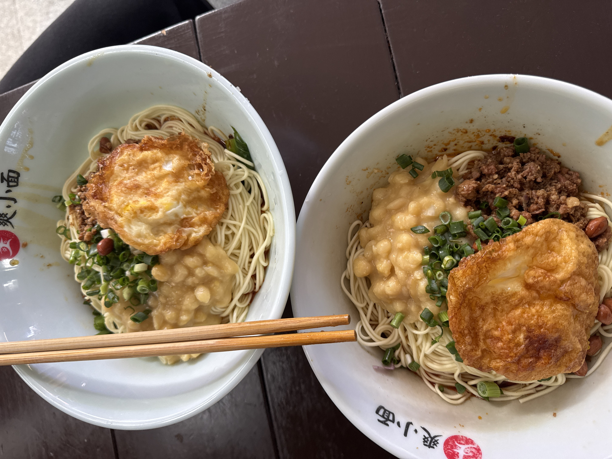 Noodle bowls with fried eggs served in Yuzhong District