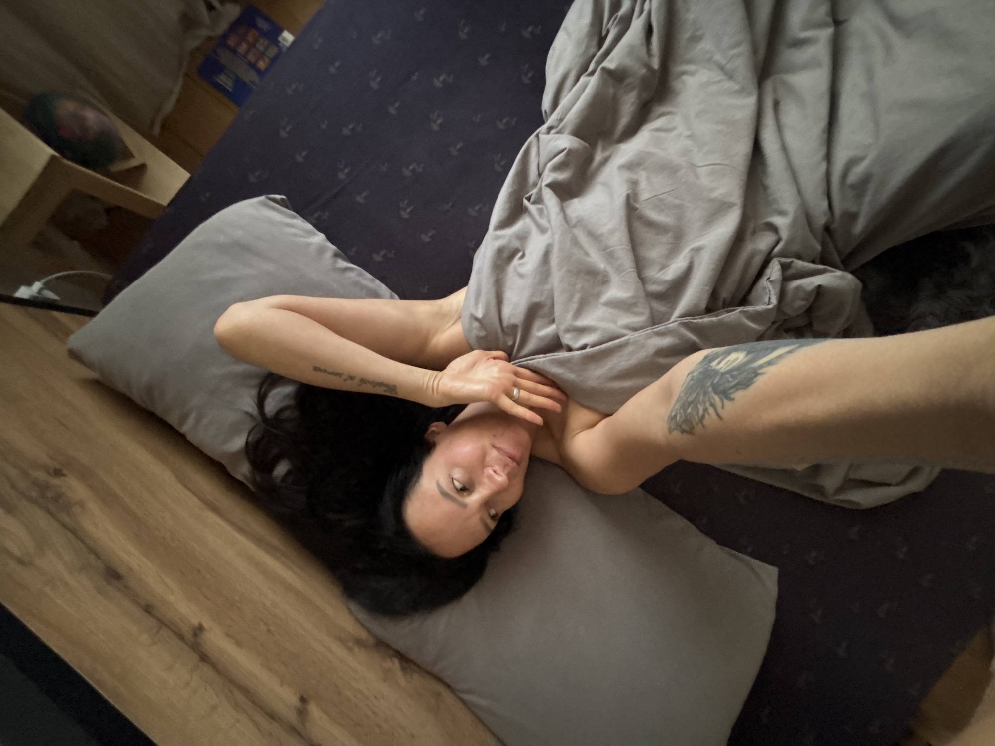 Woman rests in bedroom during early morning hours