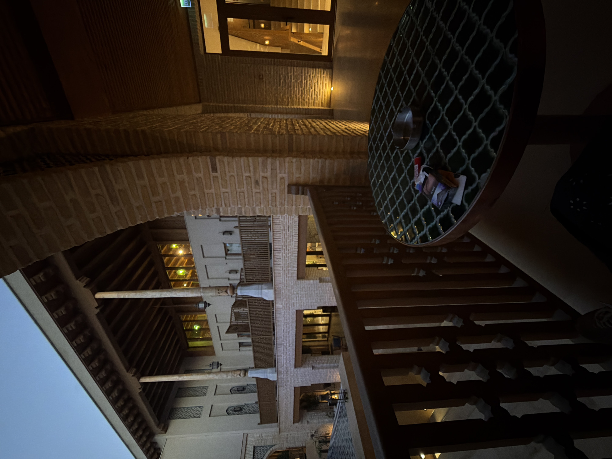 Evening architectural documentation in historic Bukhara courtyard complex
