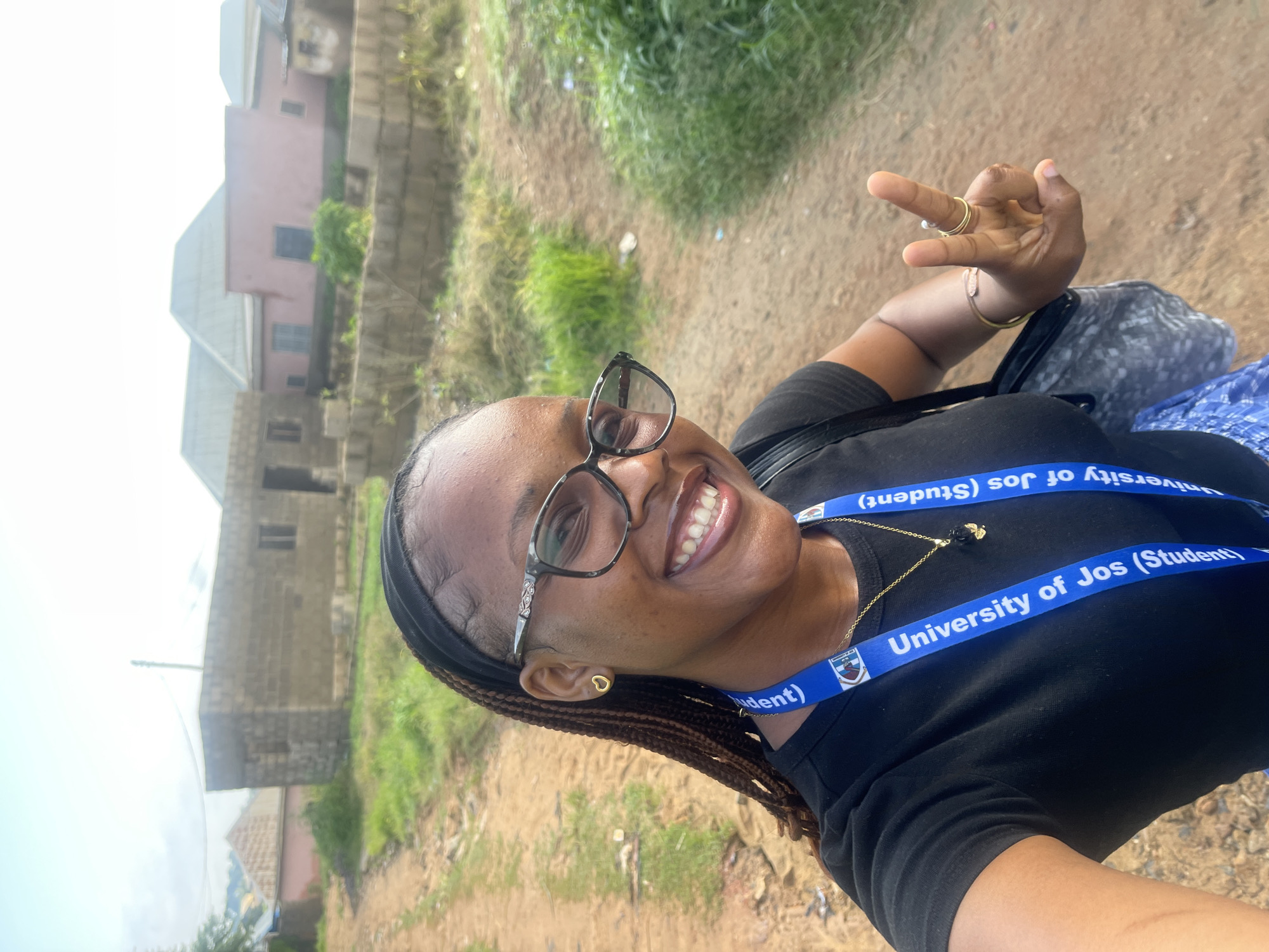 Morning street life around Rafin Par, University of Jos student in frame