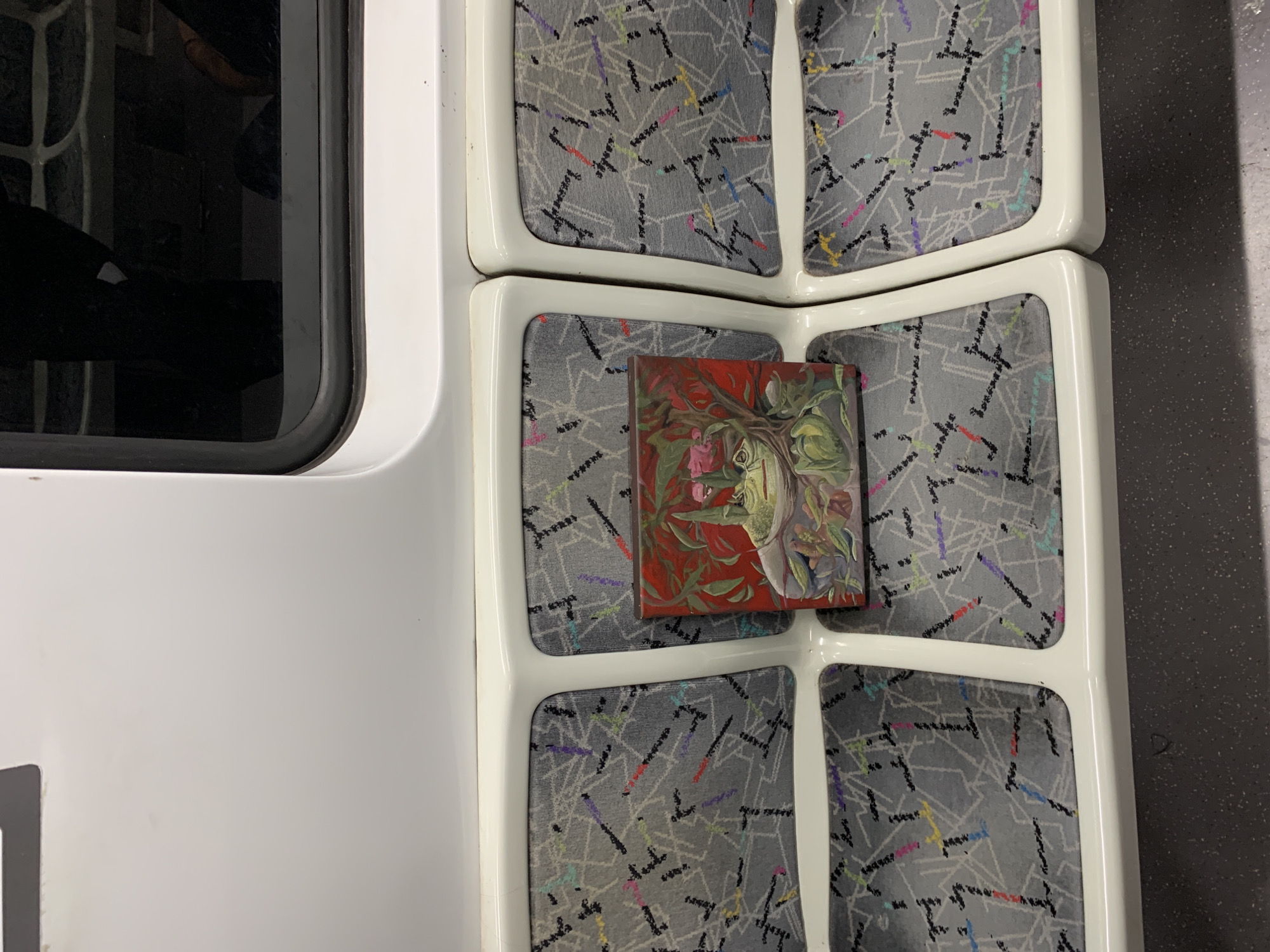 Small painting spotted on Buenos Aires transit seat