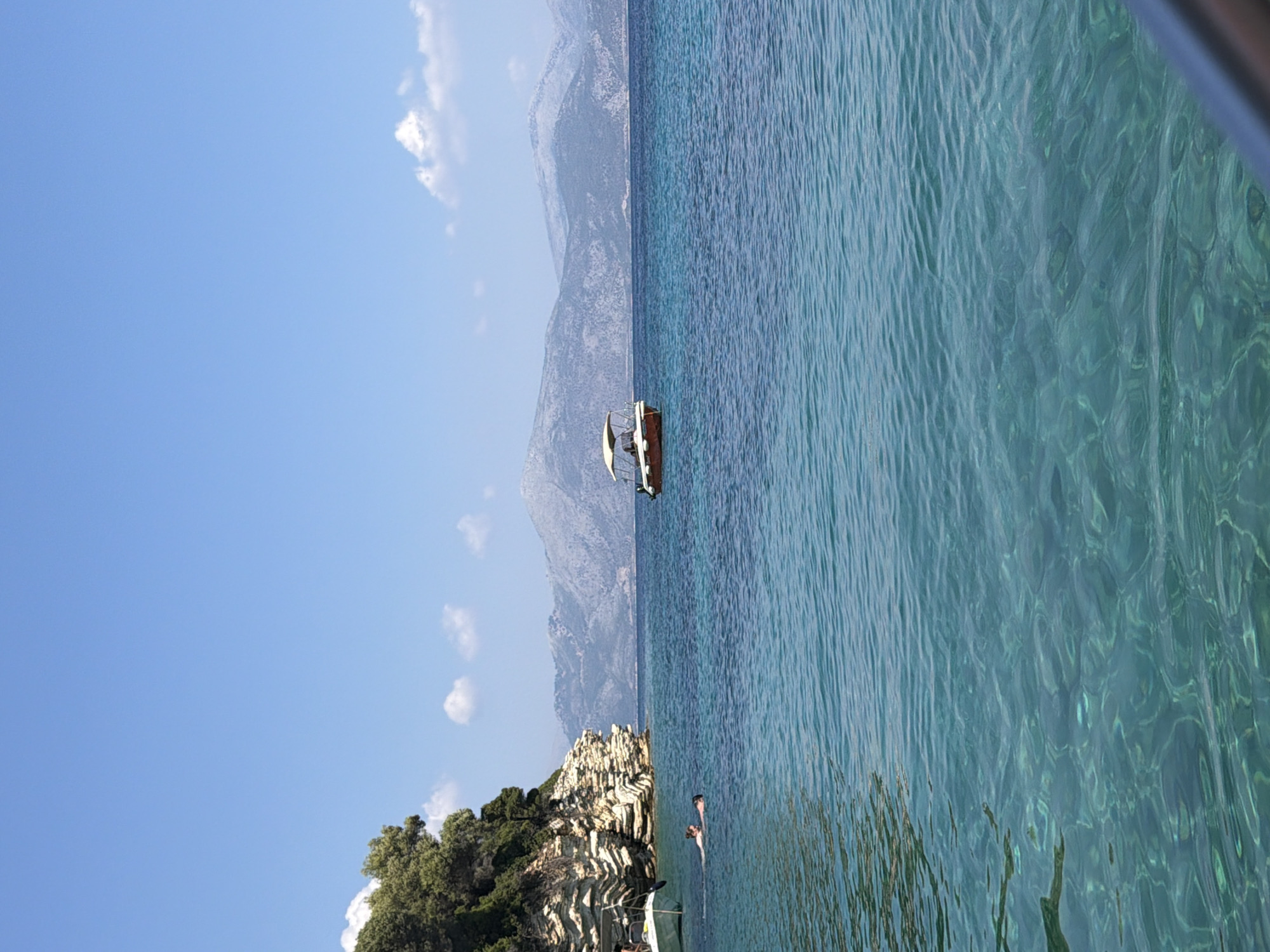 Calm turquoise waters off the coast of Kastos, Greece