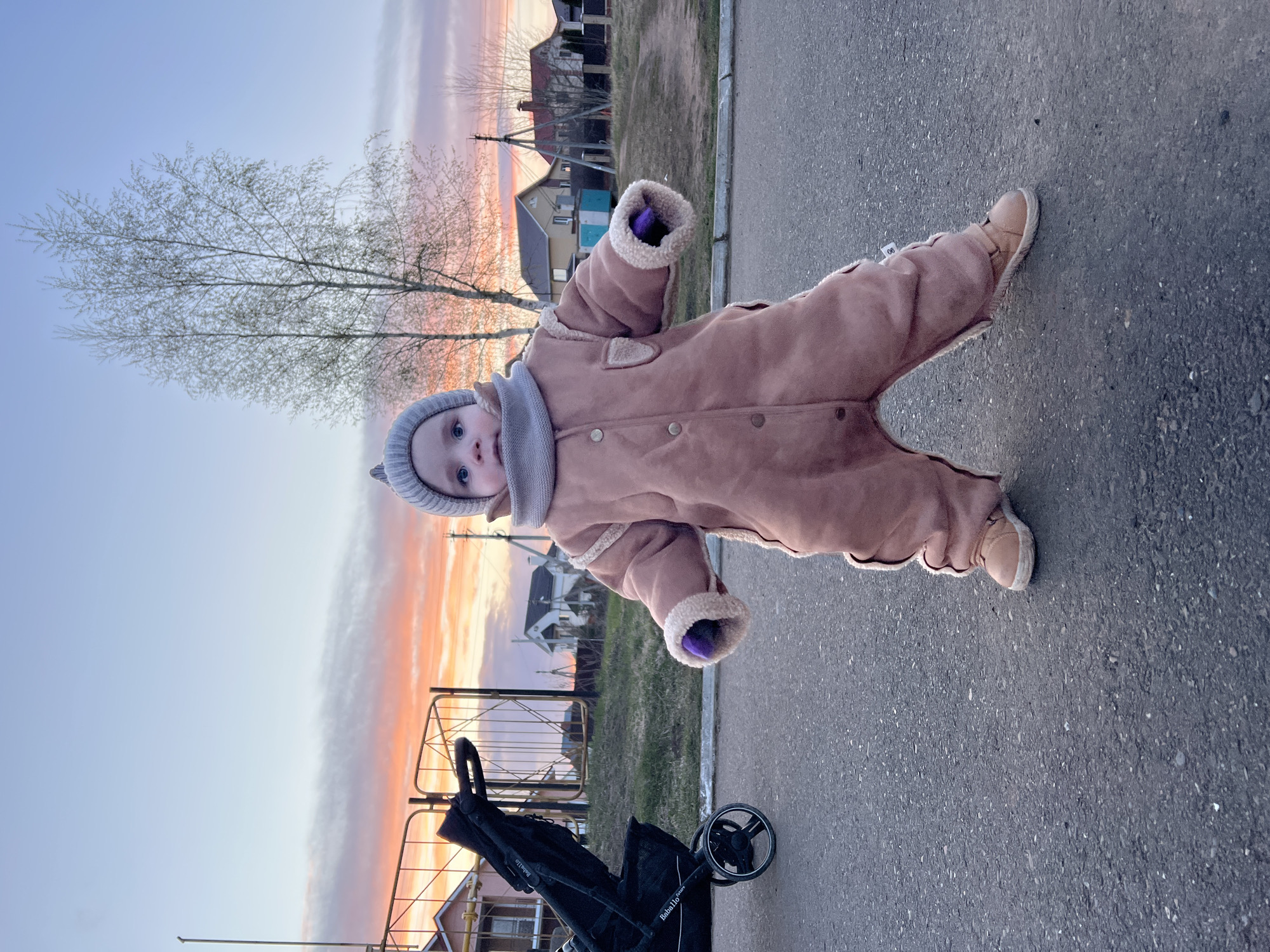 Family evening stroll captured during sunset in Noviy, Russia