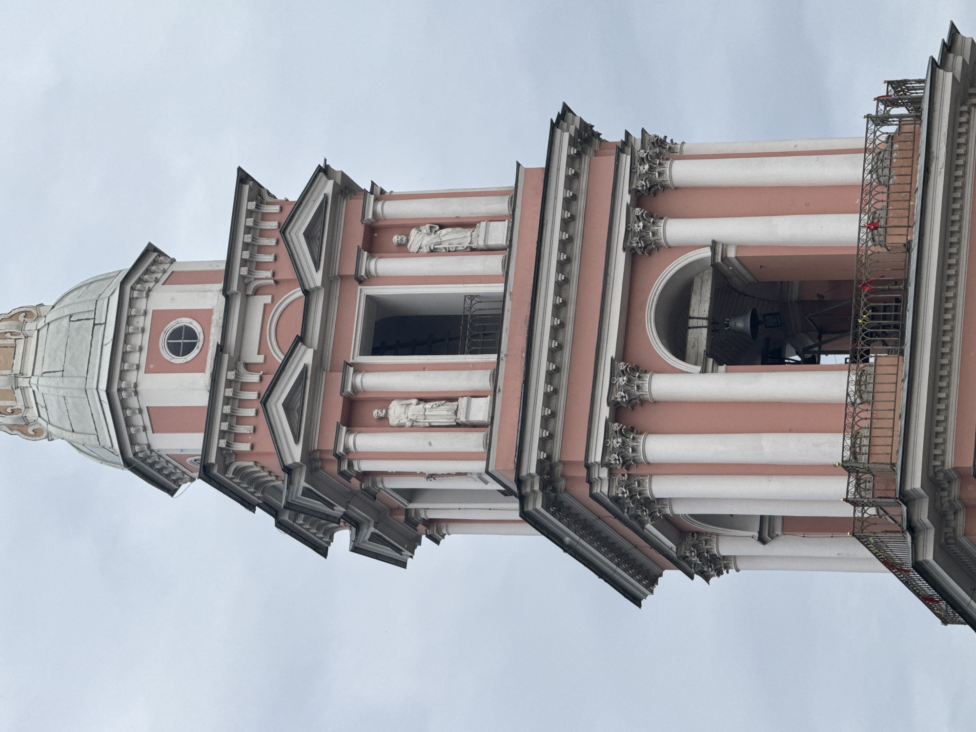 Smolny Cathedral's pink bell tower on a cloudy Saint Petersburg day