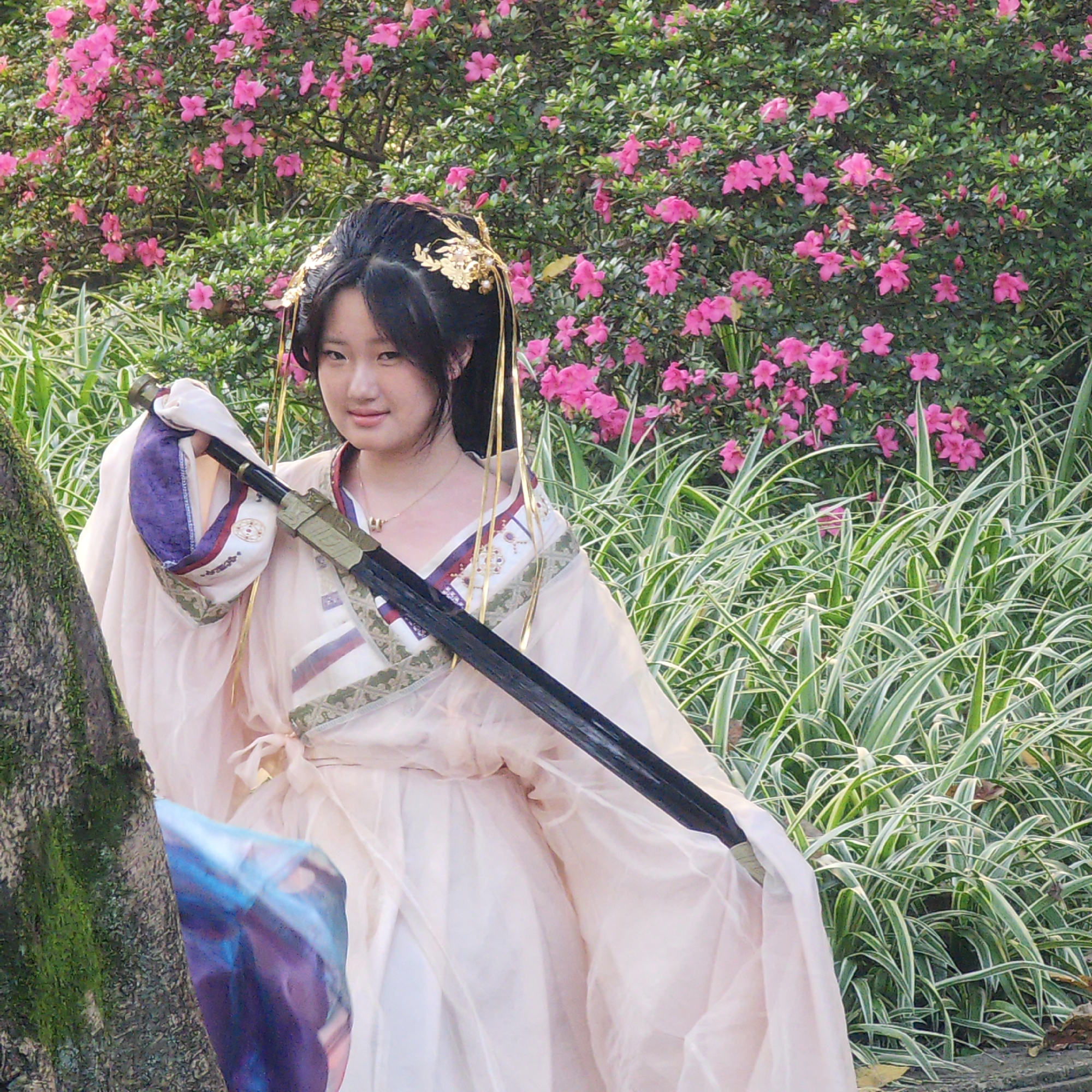 Woman in traditional dress photographed in Yuzhong District park