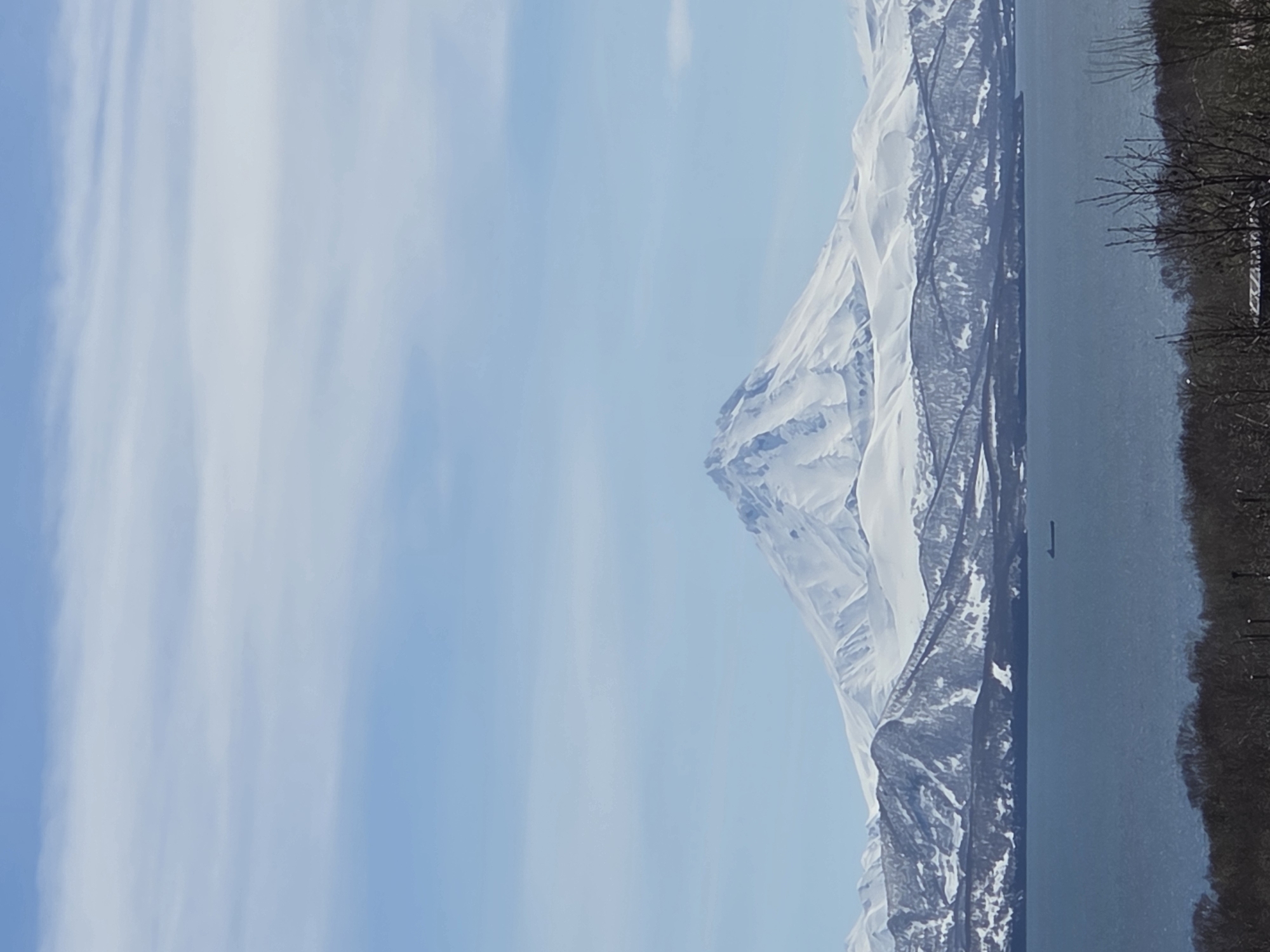 Urban witnesses document snow-capped mountain views during clear morning