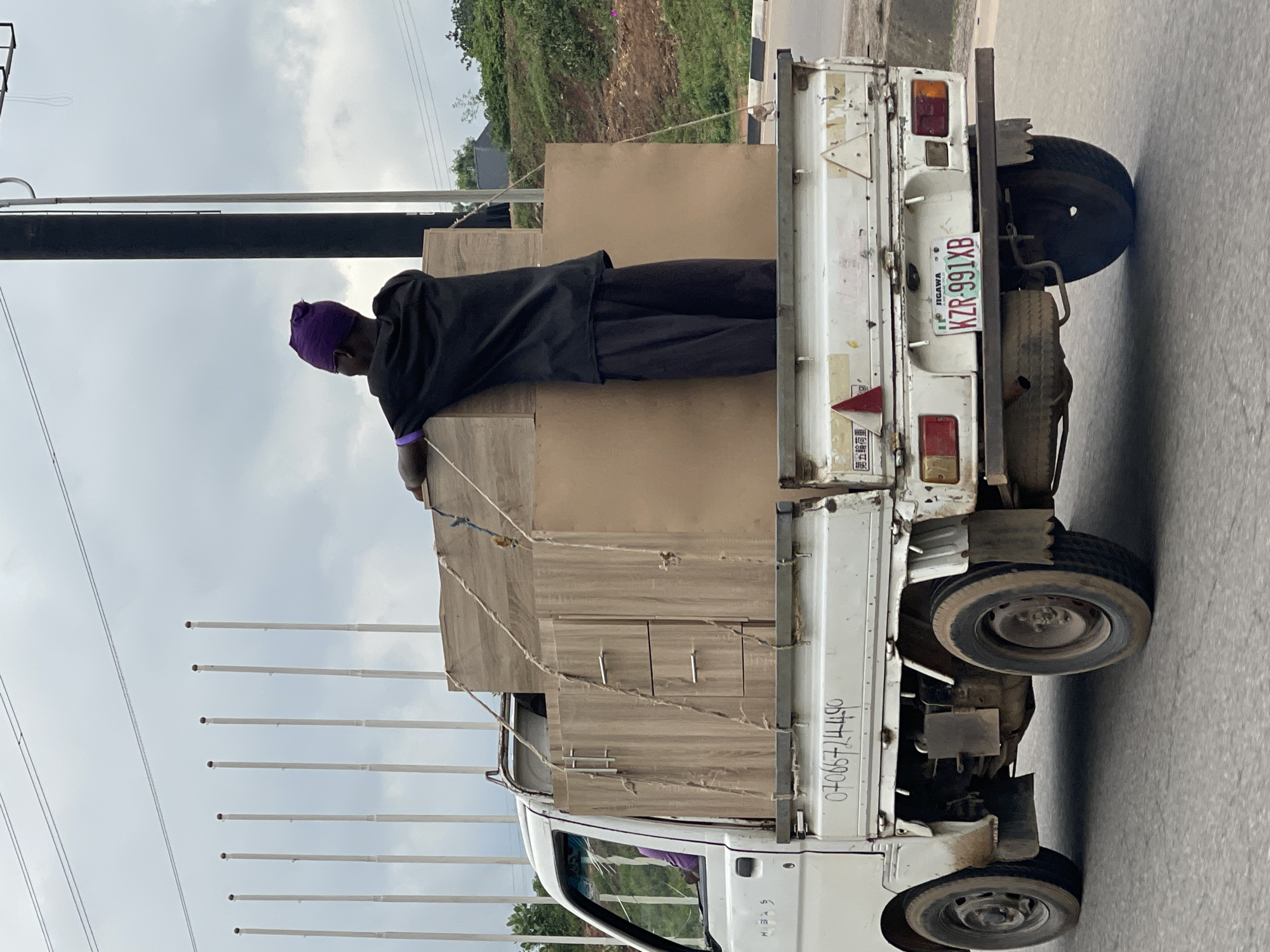 Furniture transport and street traffic near Bourdillon, Abuja