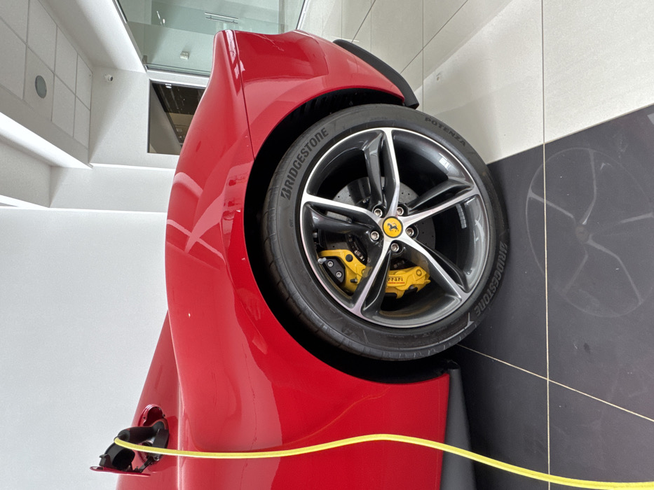Young woman visits Ferrari dealership in Sofia, takes selfies