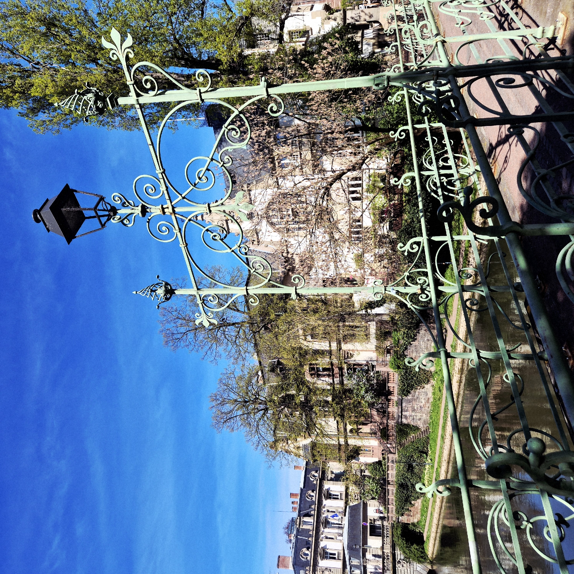 Tourist captures Strasbourg street scenes including canal bridge, graffitied bench