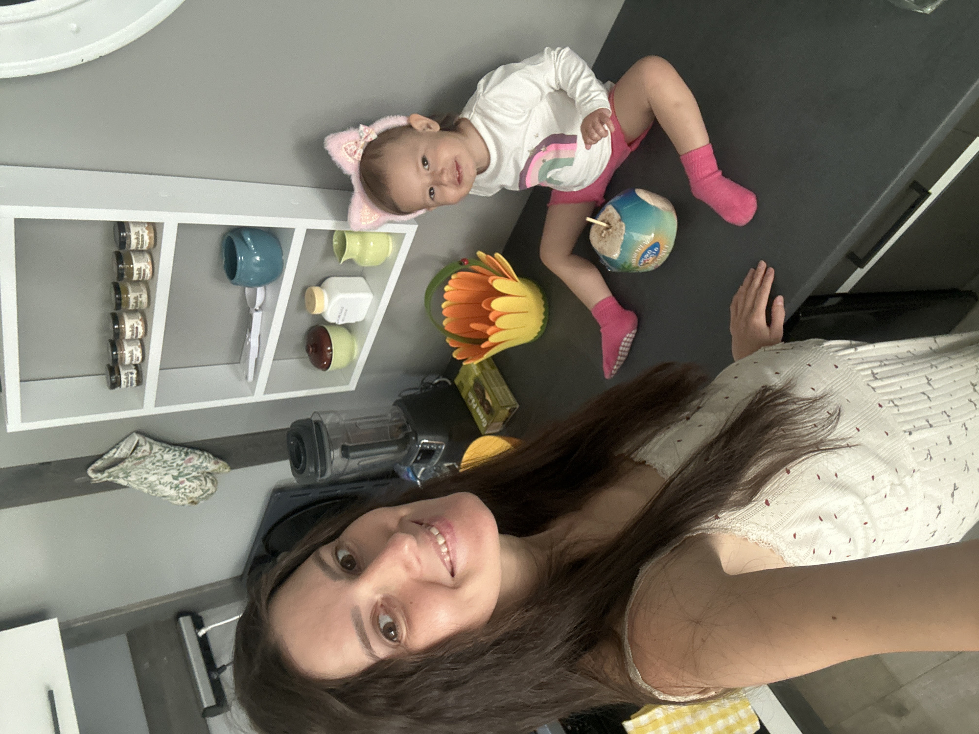 Mother and child enjoy morning coconut drinks in Wisła