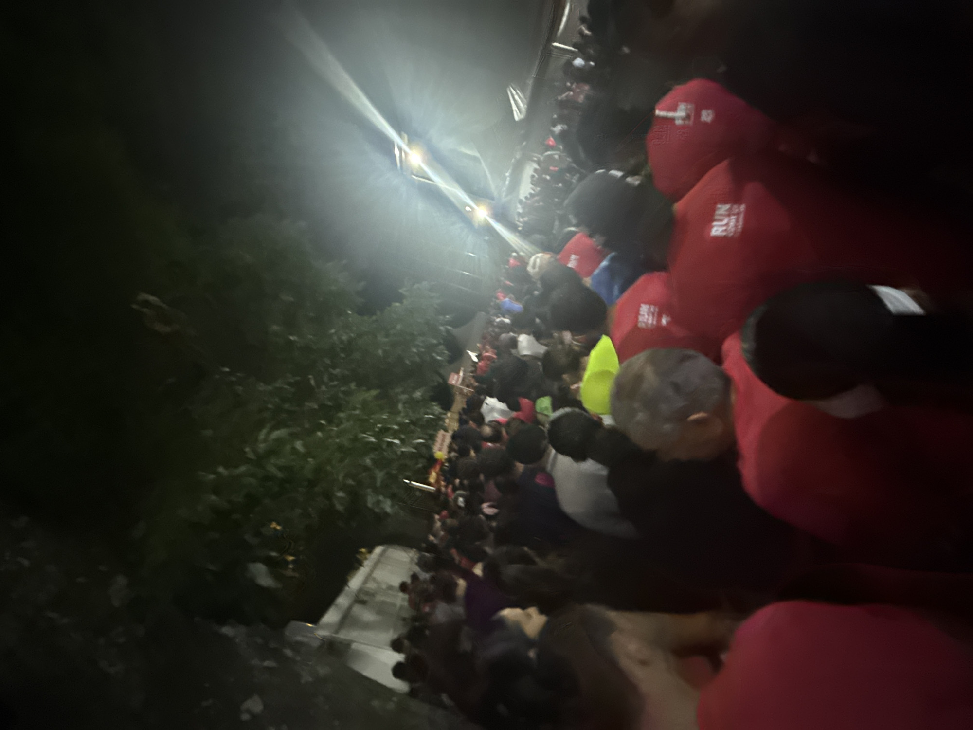 Large crowd in red shirts gathers on Mexico City bridge