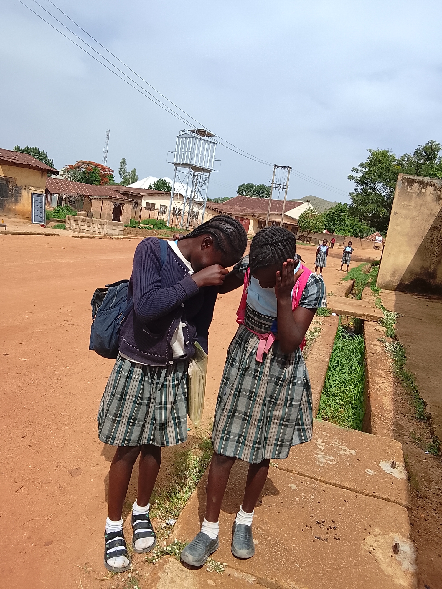 Children photographed in playful moments at same location