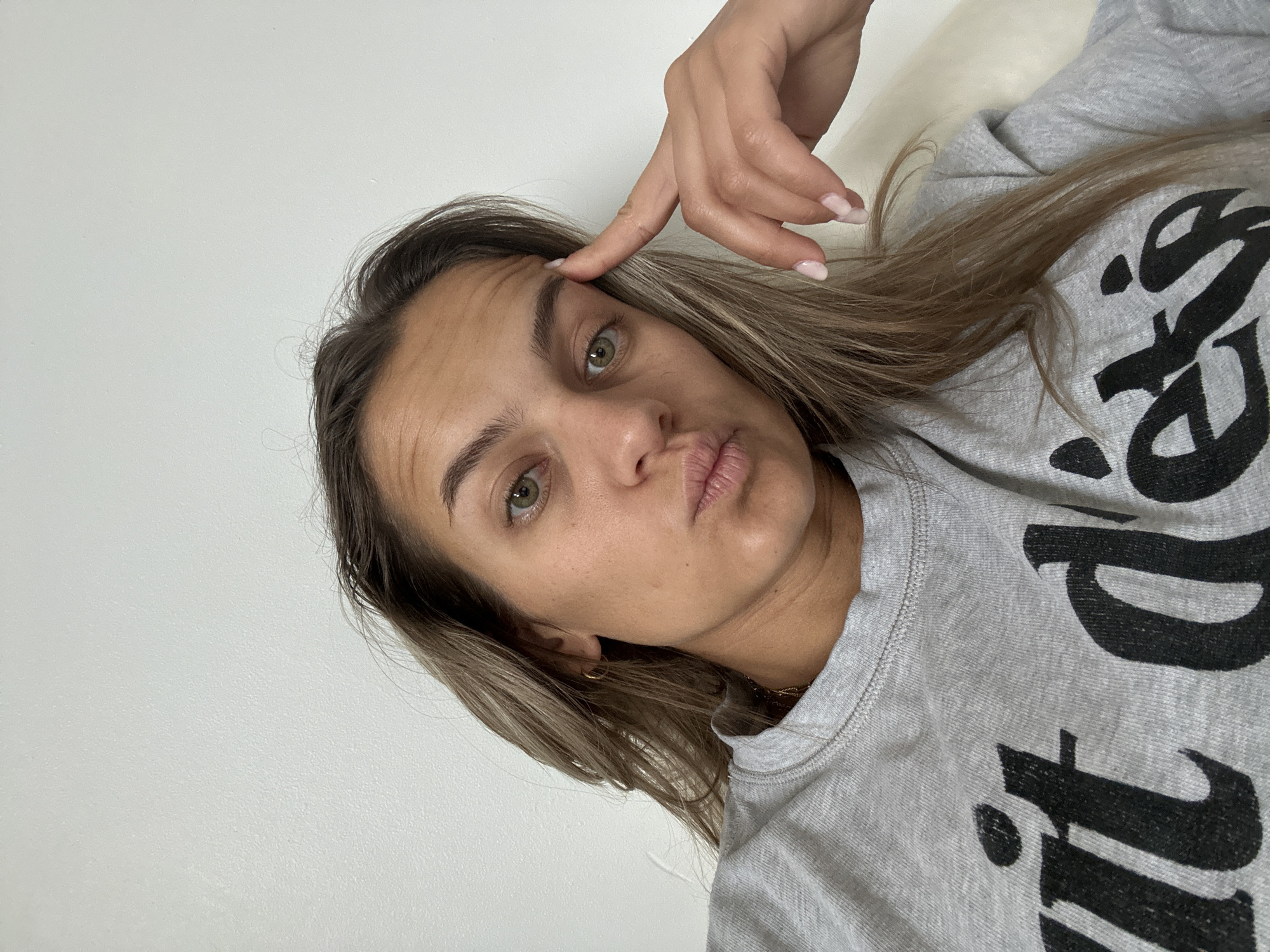 Woman takes morning selfie in French home interior