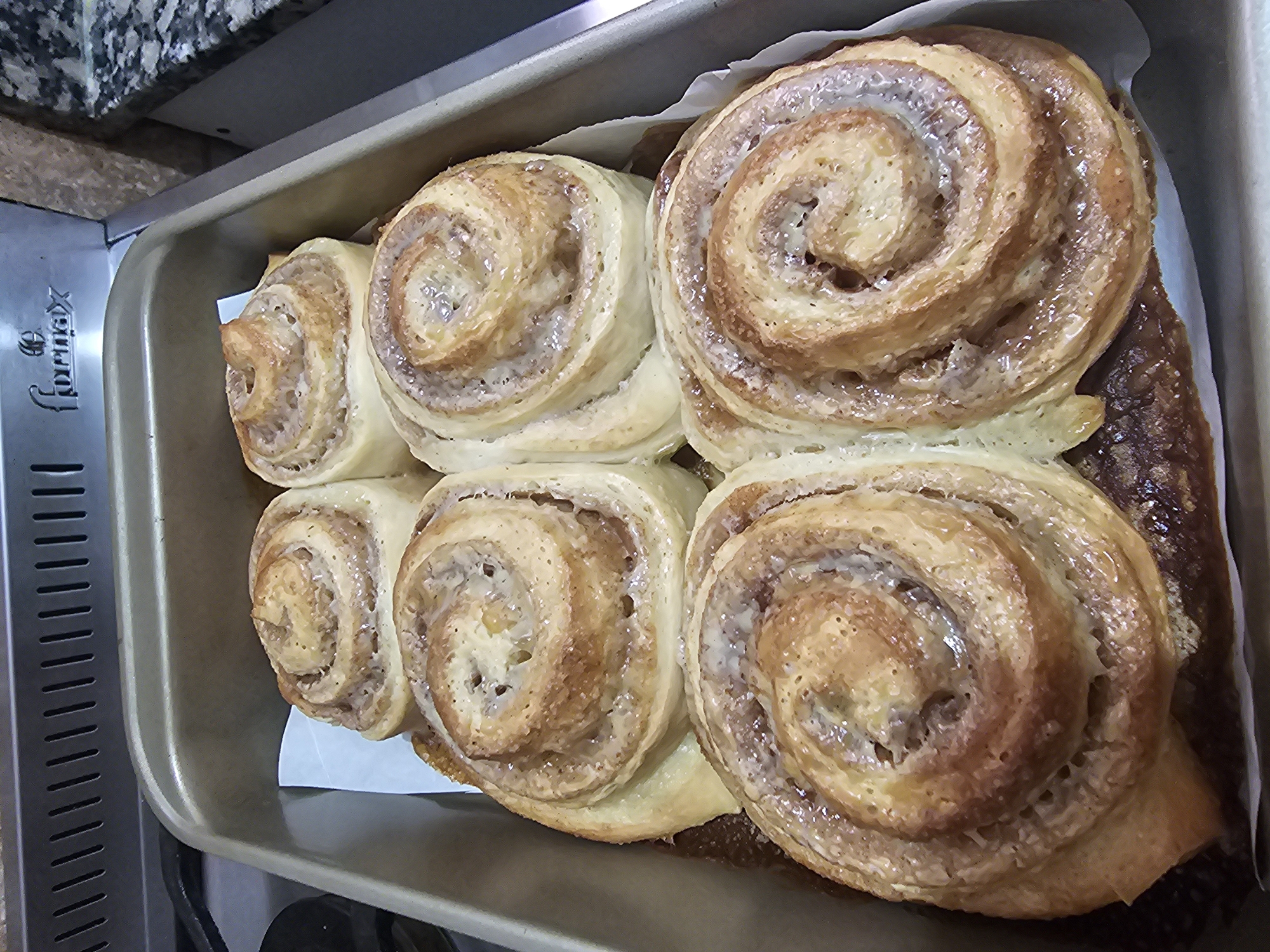Freshly baked cinnamon rolls documented in Buenos Aires kitchen