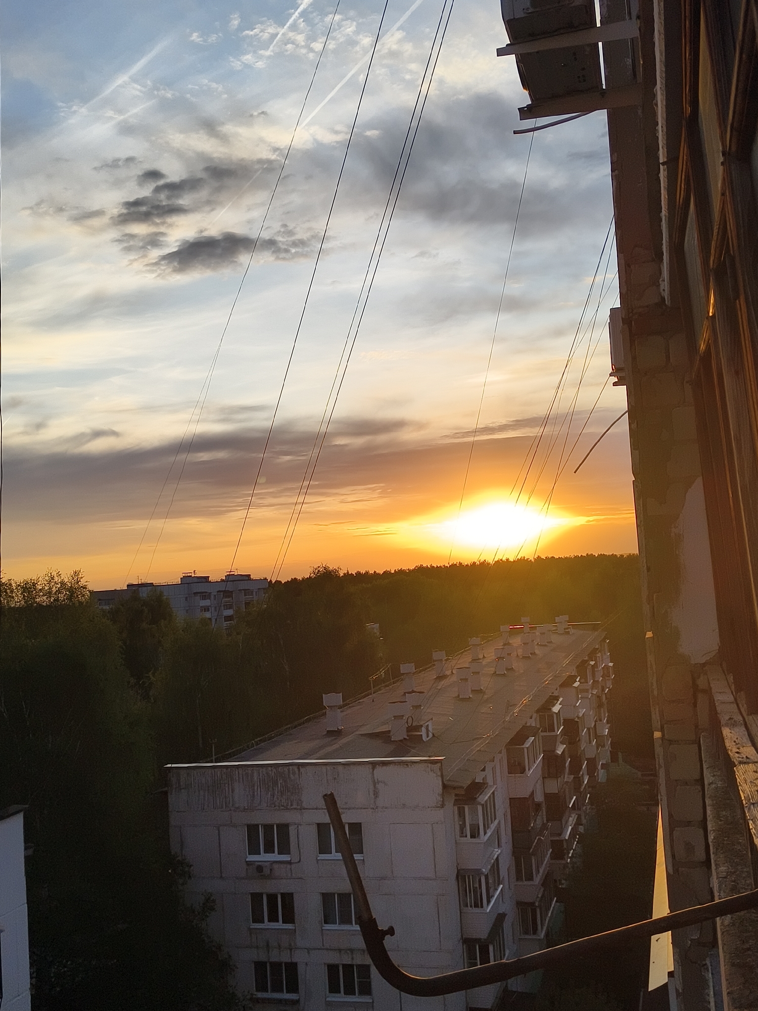 Urban sunset documented from multiple apartment viewpoints
