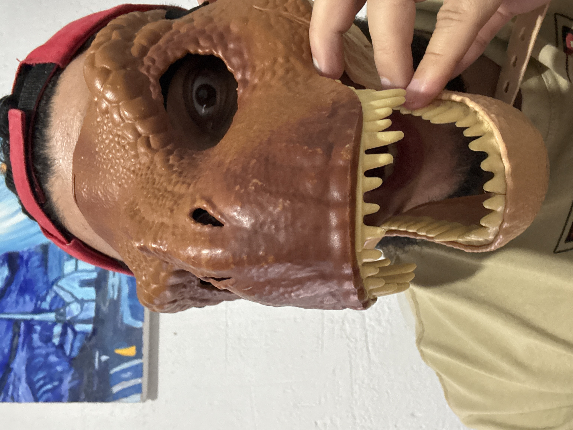 Costume contest fun with dinosaur mask and toy props in Cuernavaca