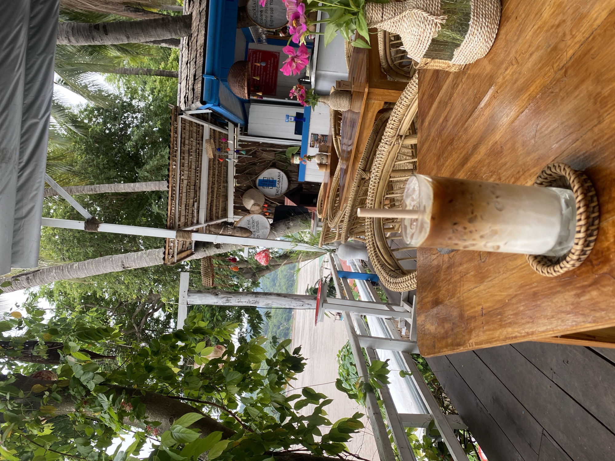 Iced coffee and Mekong River views at a Luang Prabang cafe