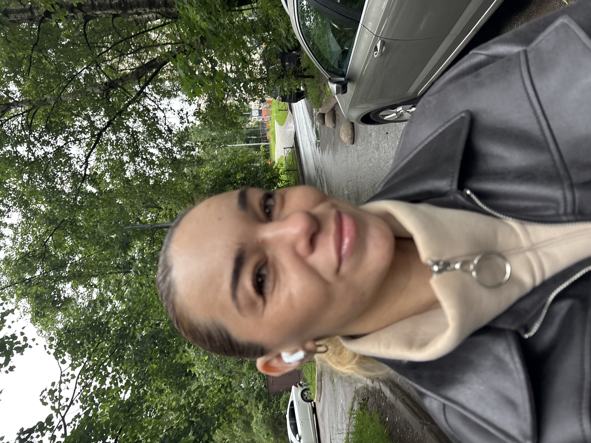 Selfie session on a Vsevolozhsk walkway, June morning