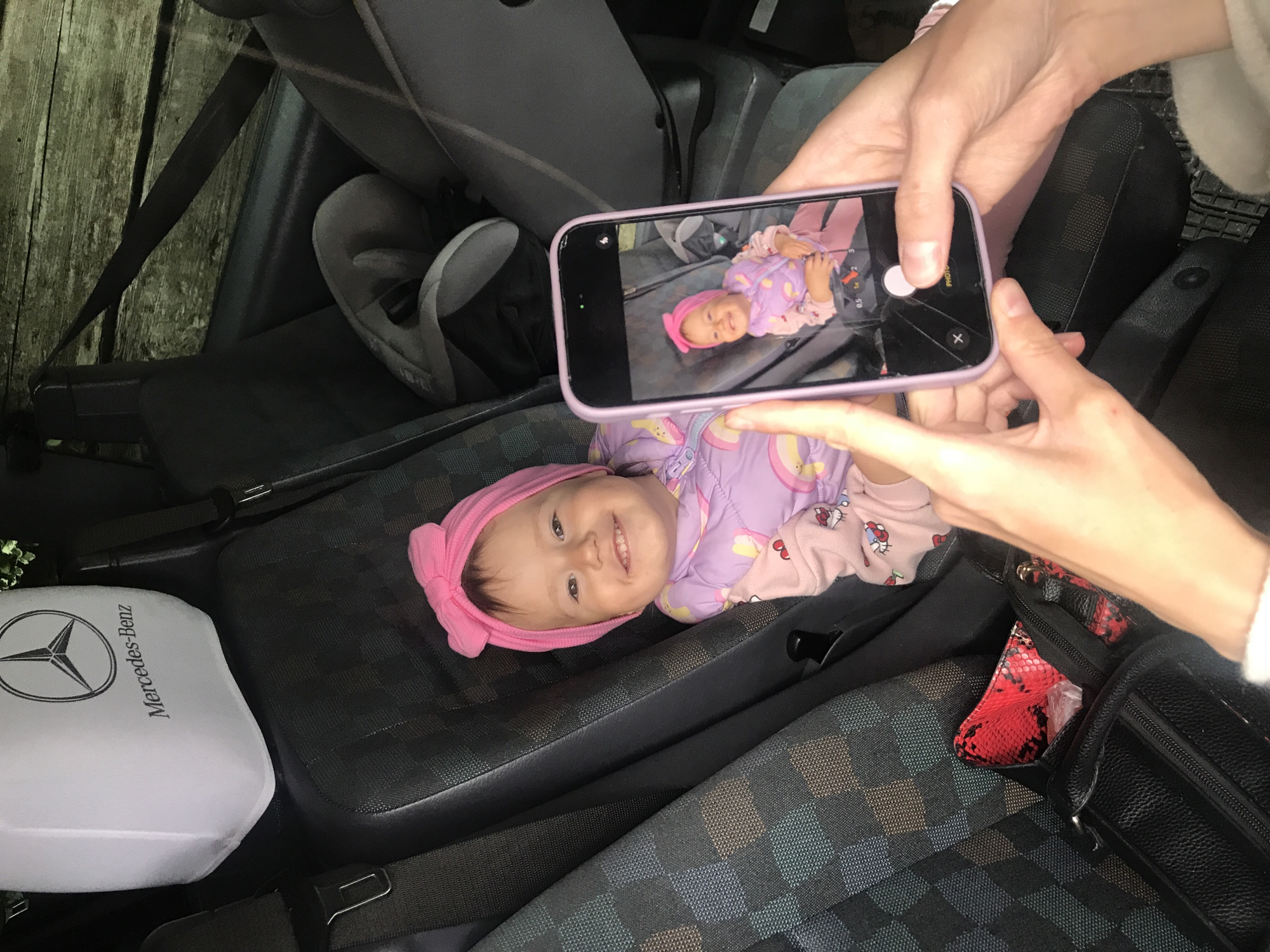 Baby photographed on car seat in Wisła, Poland