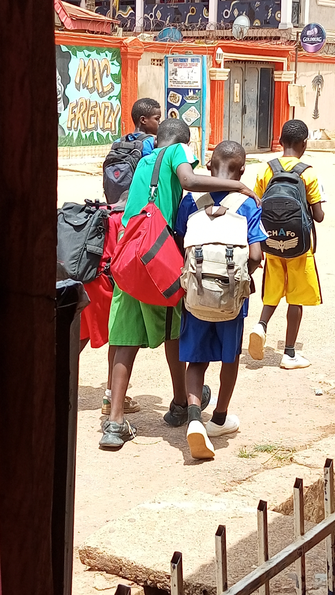 Students walk dirt roads during school hours in Sabon Tasha