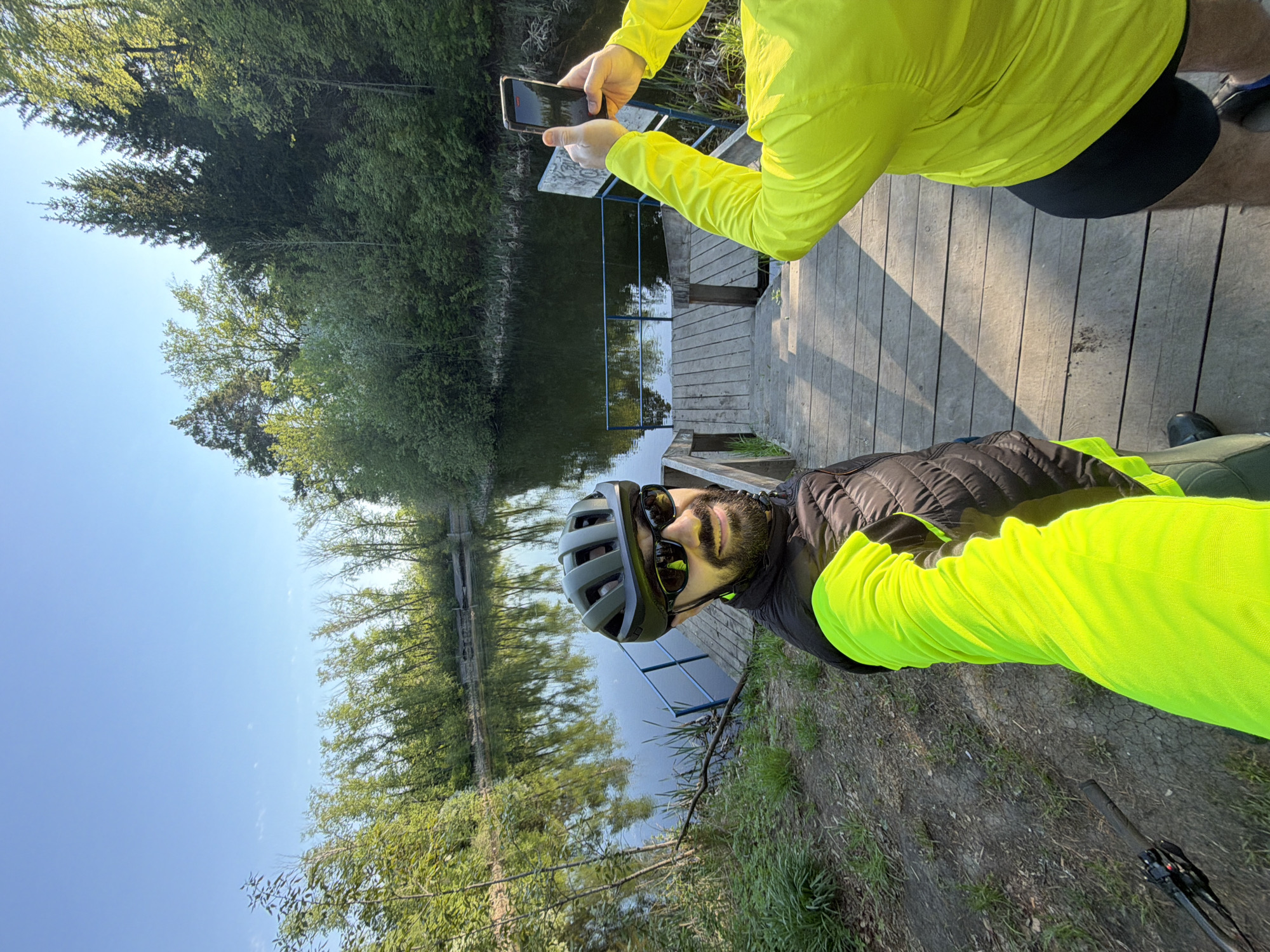 Cyclist in safety gear photographed on Tyumen waterfront dock
