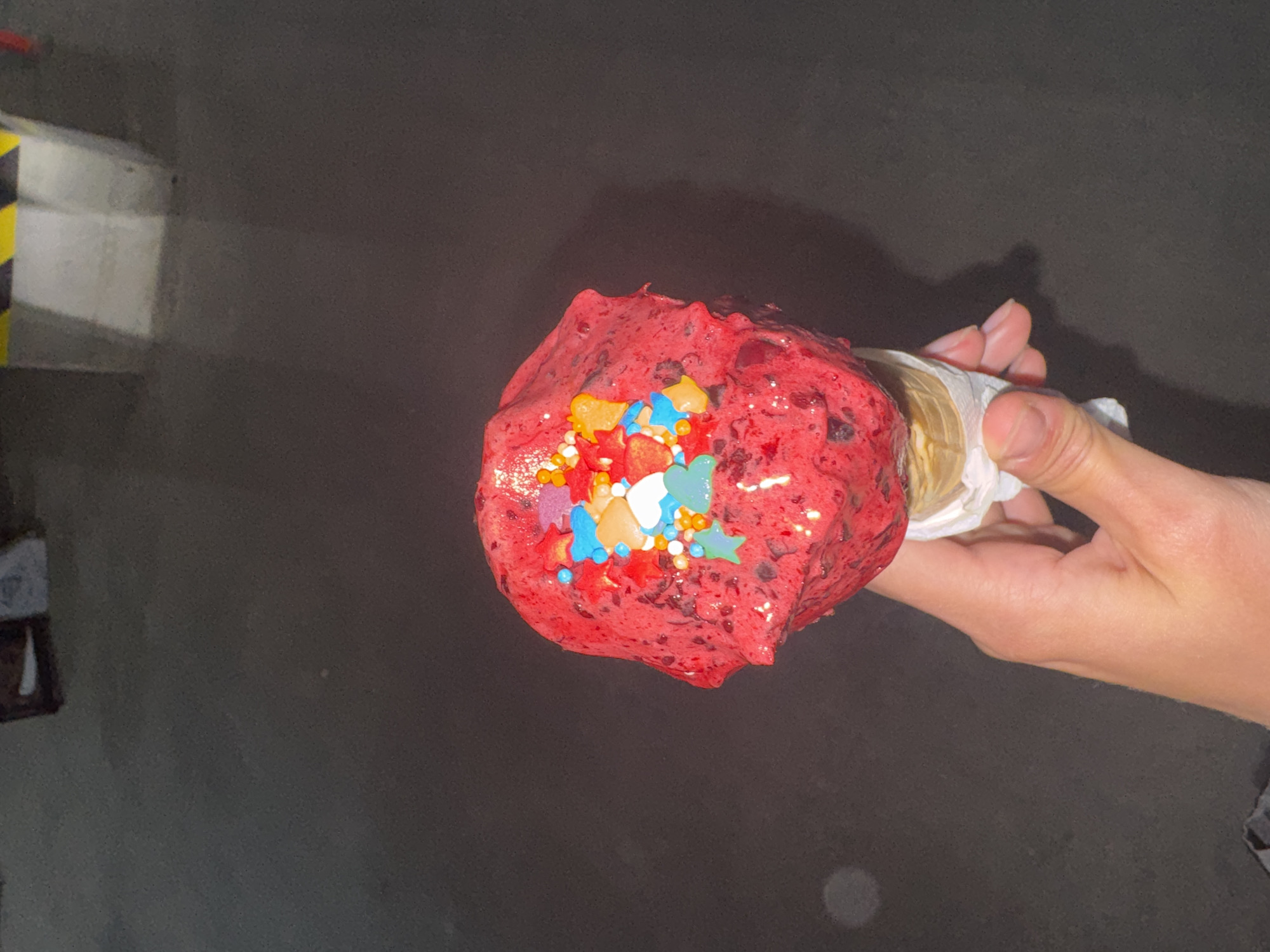 Woman enjoys red ice cream, visits exercise studio