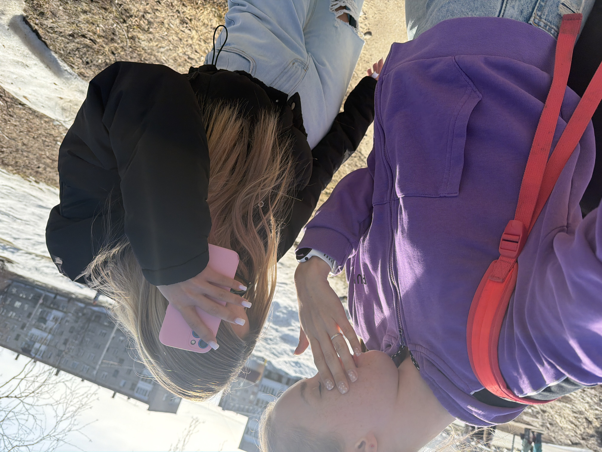 Two women take selfies, document street scenes in Berezniki