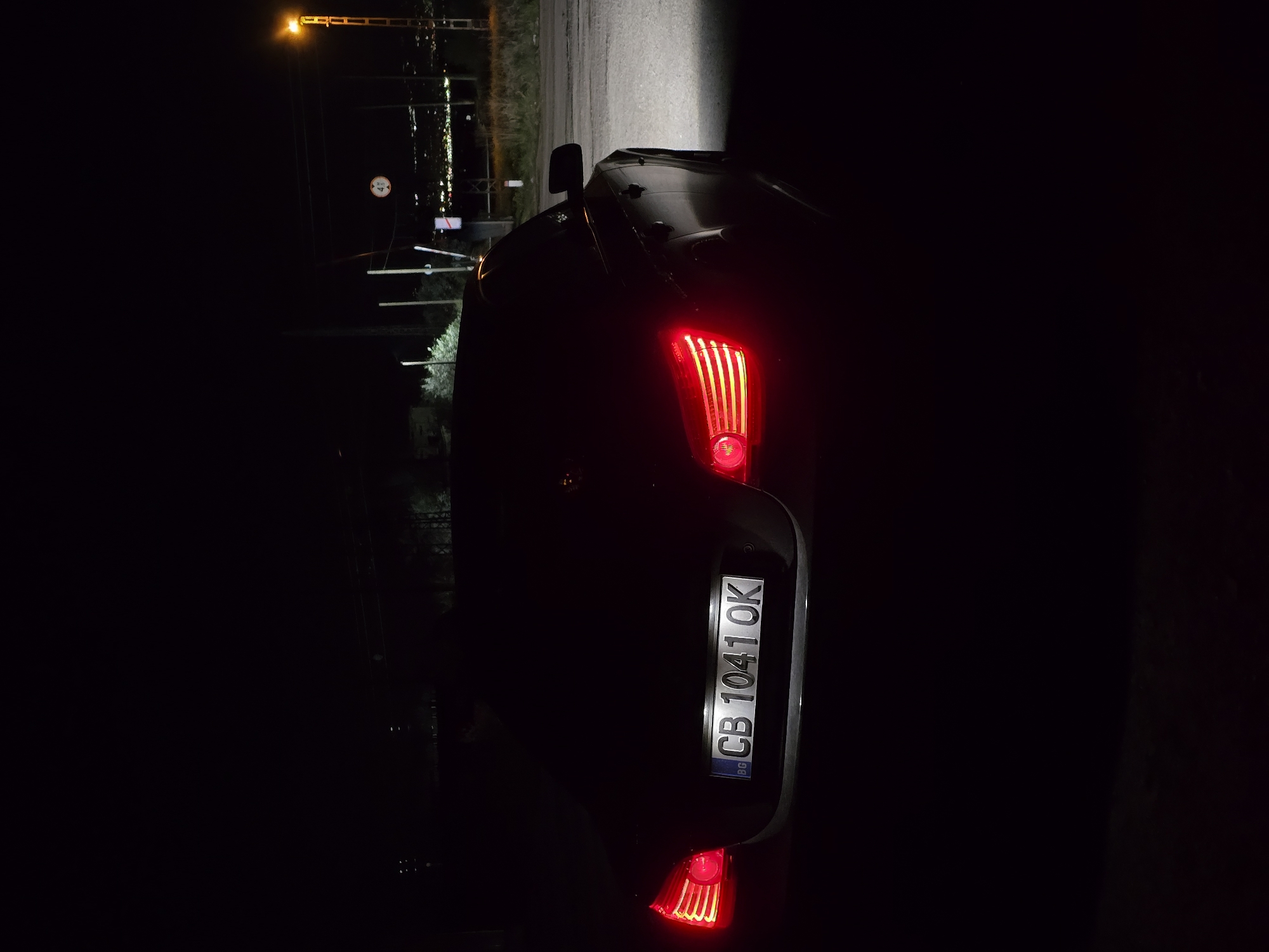 Car with brake lights observed in nighttime Sofia street