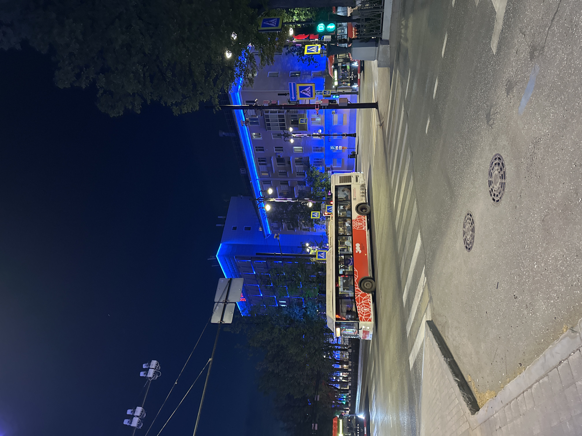 Evening scenes captured in Perm: bus crossing, park art