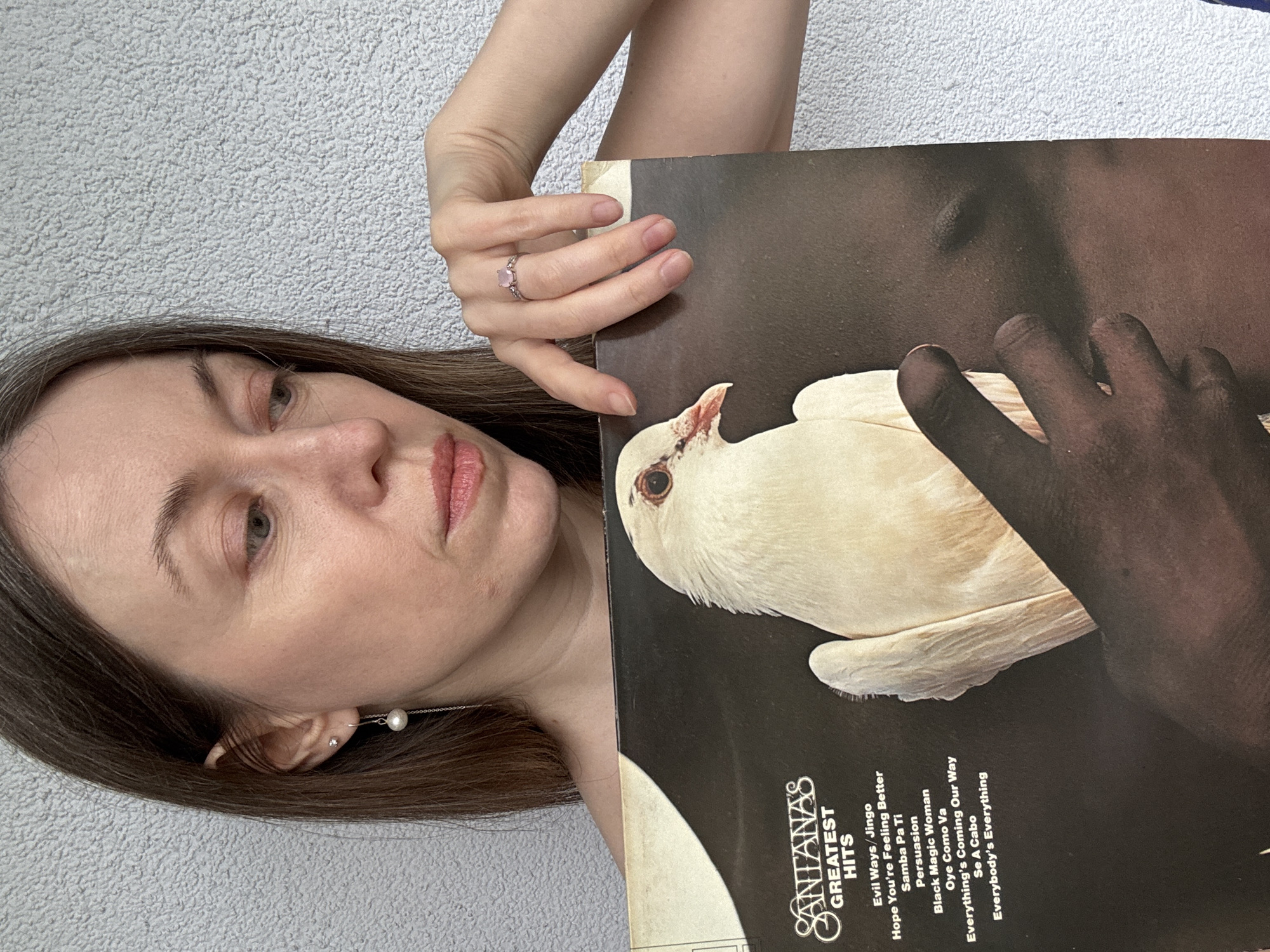 Woman poses with vinyl records in Kudrovo, Russia