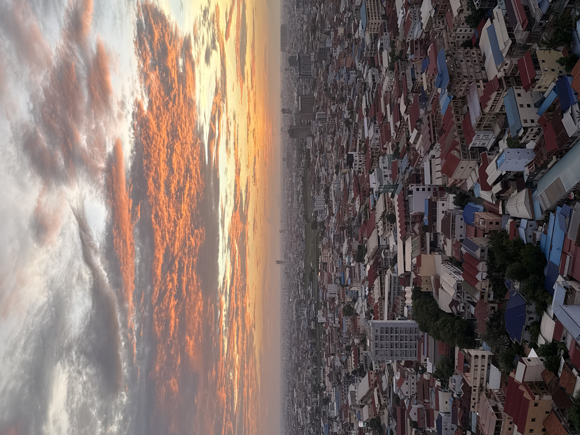 Sunset clouds over Khan Mean Chey's dense urban sprawl