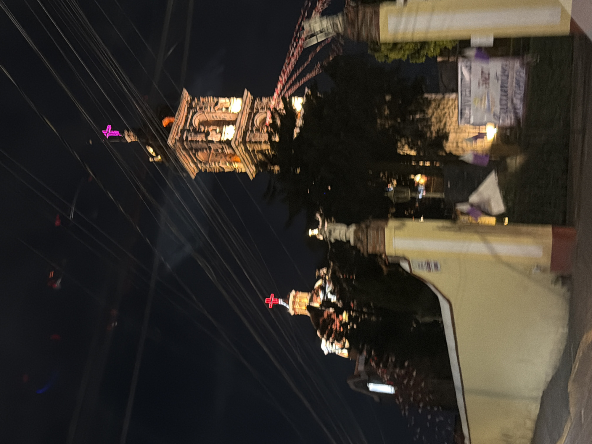 Historic illuminated churches photographed at night in Cholula